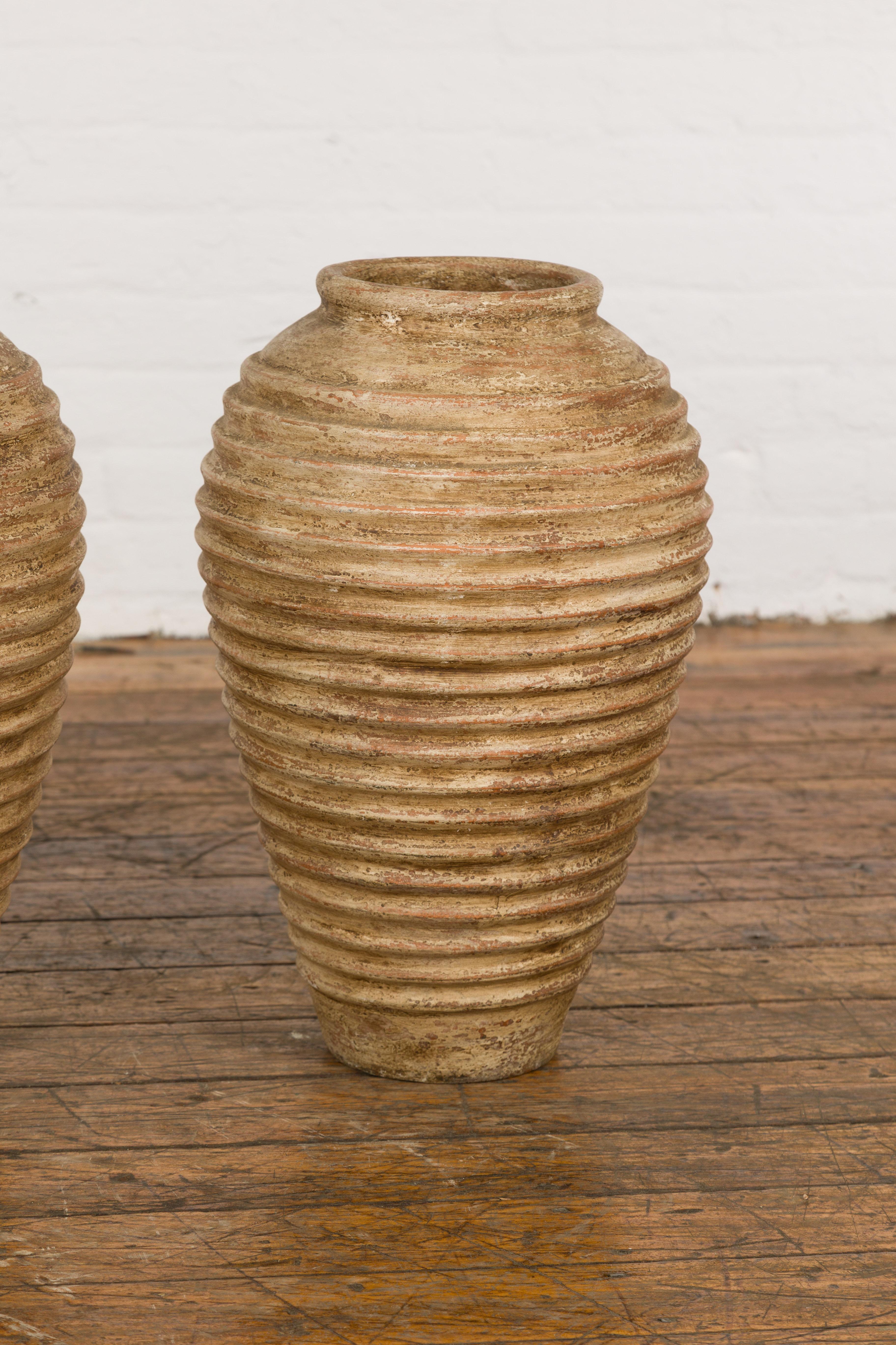 Terracotta Near Pair of Vintage Jars with Textured Surface For Sale