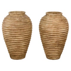 Near Pair of Used Jars with Textured Surface