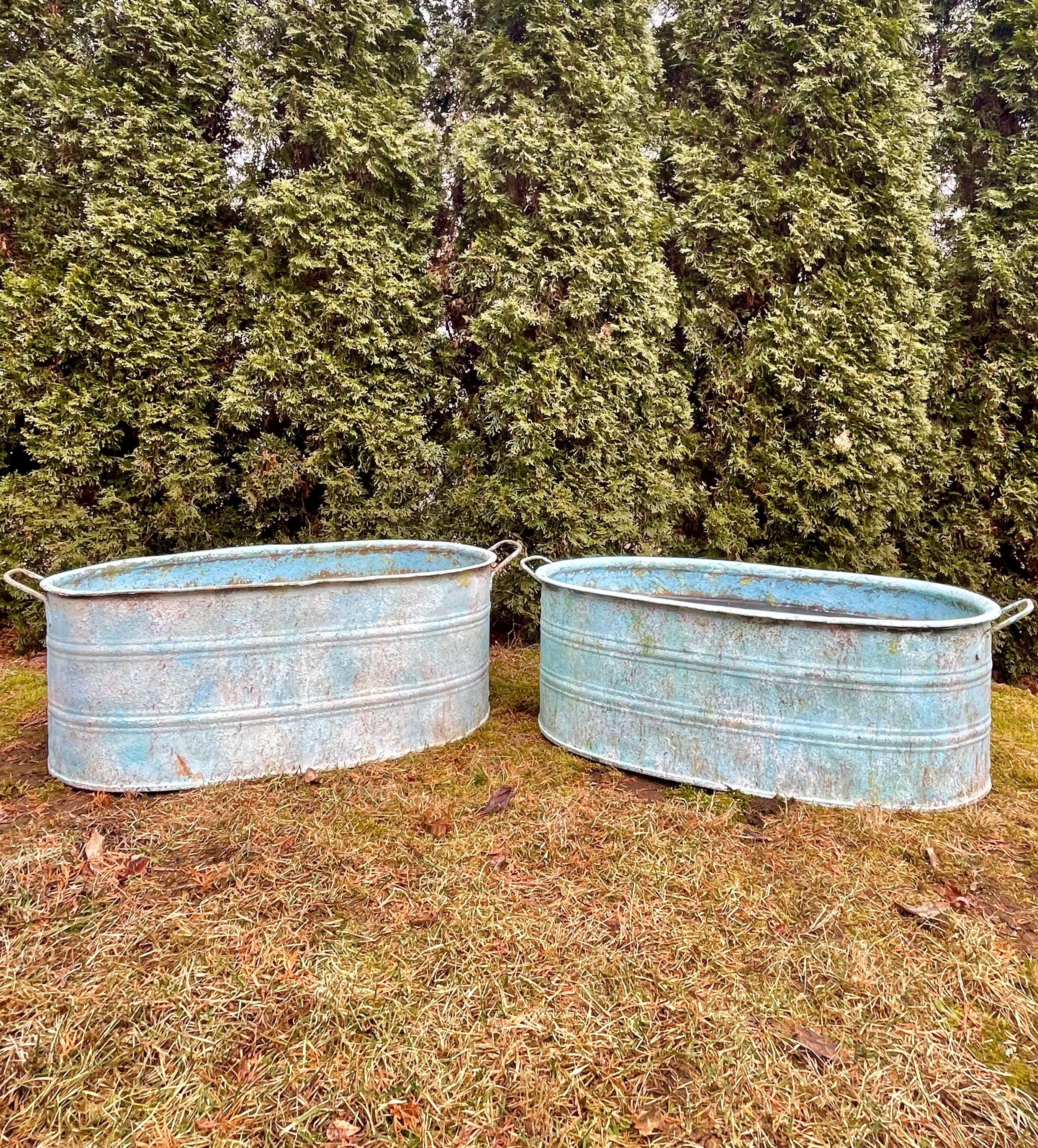 We were fortunate to source several near-pairs of these marvelous galvanized tub planters that date to the 1930s and had them custom-finished by a very talented artisan in Spain. This is one of three near-pairs that we have (the fourth near-pair is