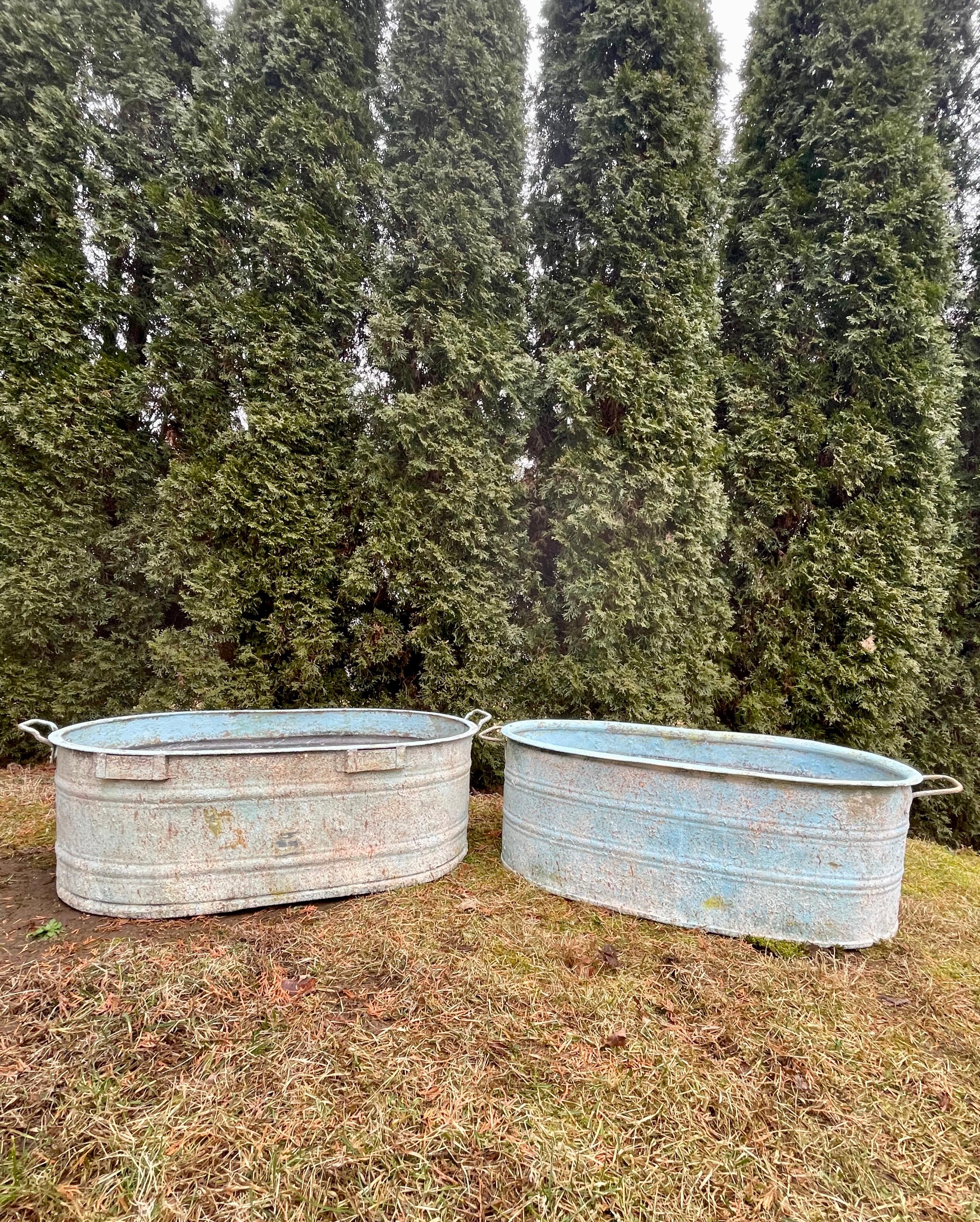 We were fortunate to source several near-pairs of these marvelous galvanized tub planters that date to the 1930s and had them custom-finished by a very talented artisan in Spain. This is one of three near-pairs that we have (the fourth near-pair is