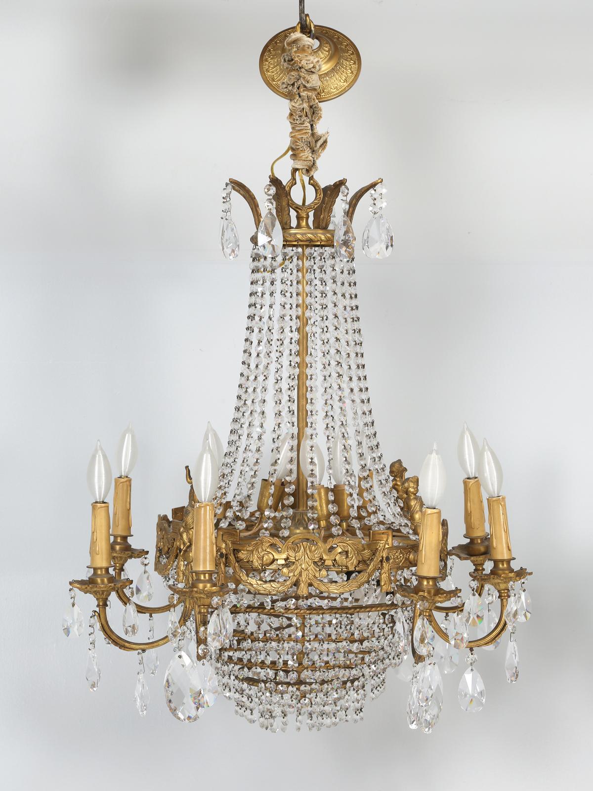 Pair, well not exactly, but I believe the proper term is near pair of old French crystal chandeliers, that although made by the same company, they are about a 95% match. Unless you look very carefully, one would never suspect there was any