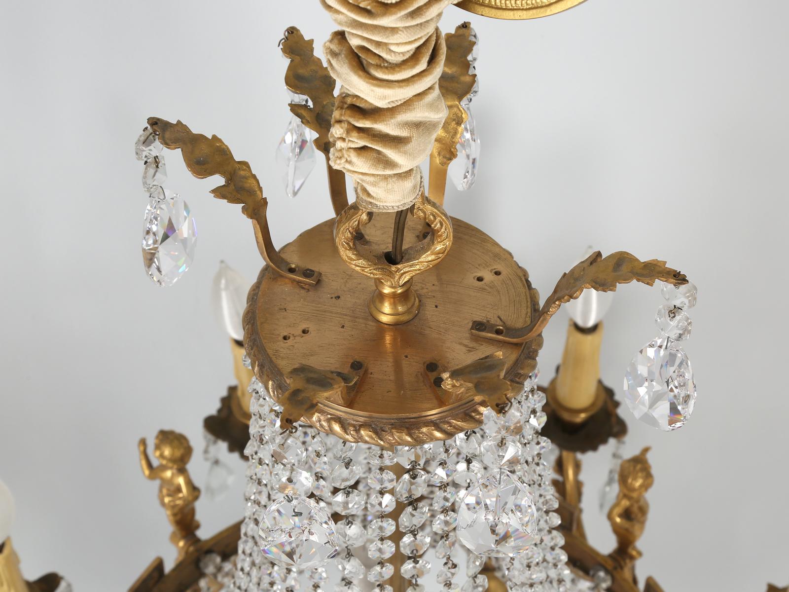 Hand-Crafted Near Pair of Vintage French Empire Style Crystal Gilded Chandeliers Early 1900's For Sale