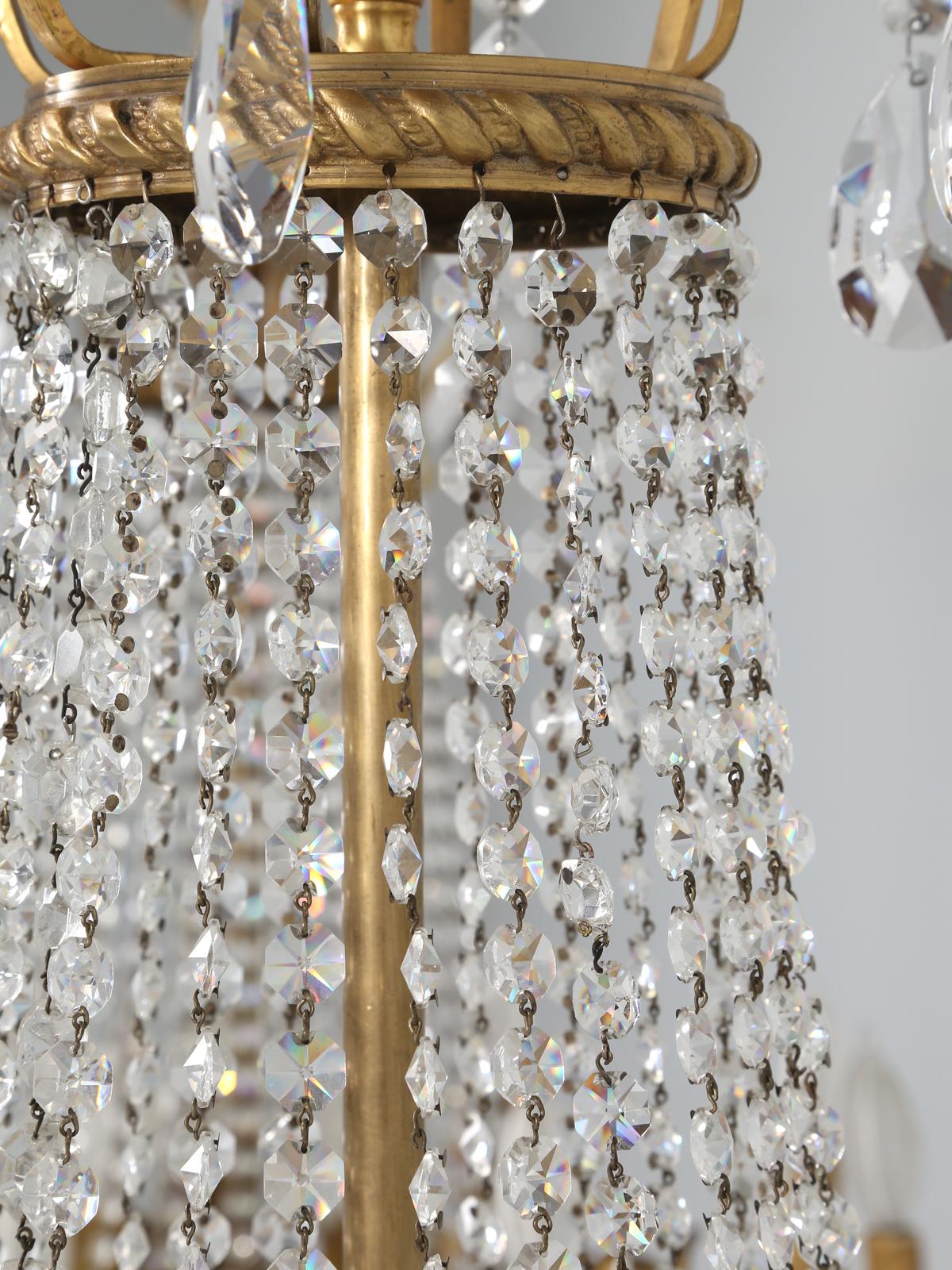 Near Pair of Vintage French Empire Style Crystal Gilded Chandeliers Early 1900's In Good Condition For Sale In Chicago, IL