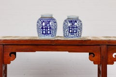 Near Pair of White and Blue Porcelain Double Happiness Lidded Ginger Jars