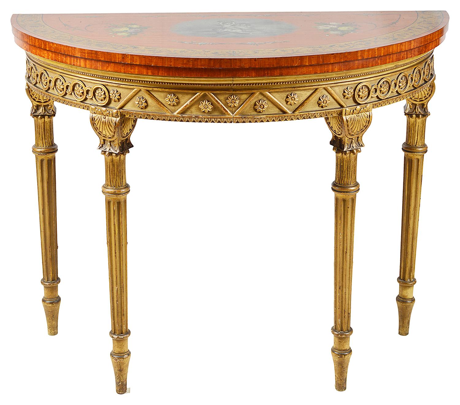 A very good quality near pair of Sheraton revival Satinwood card tables, each with classical painted decoration to the tops, opening to reveal baise covered card play surfaces. The frieze with carved blind fretwork with ivory painted and gilded