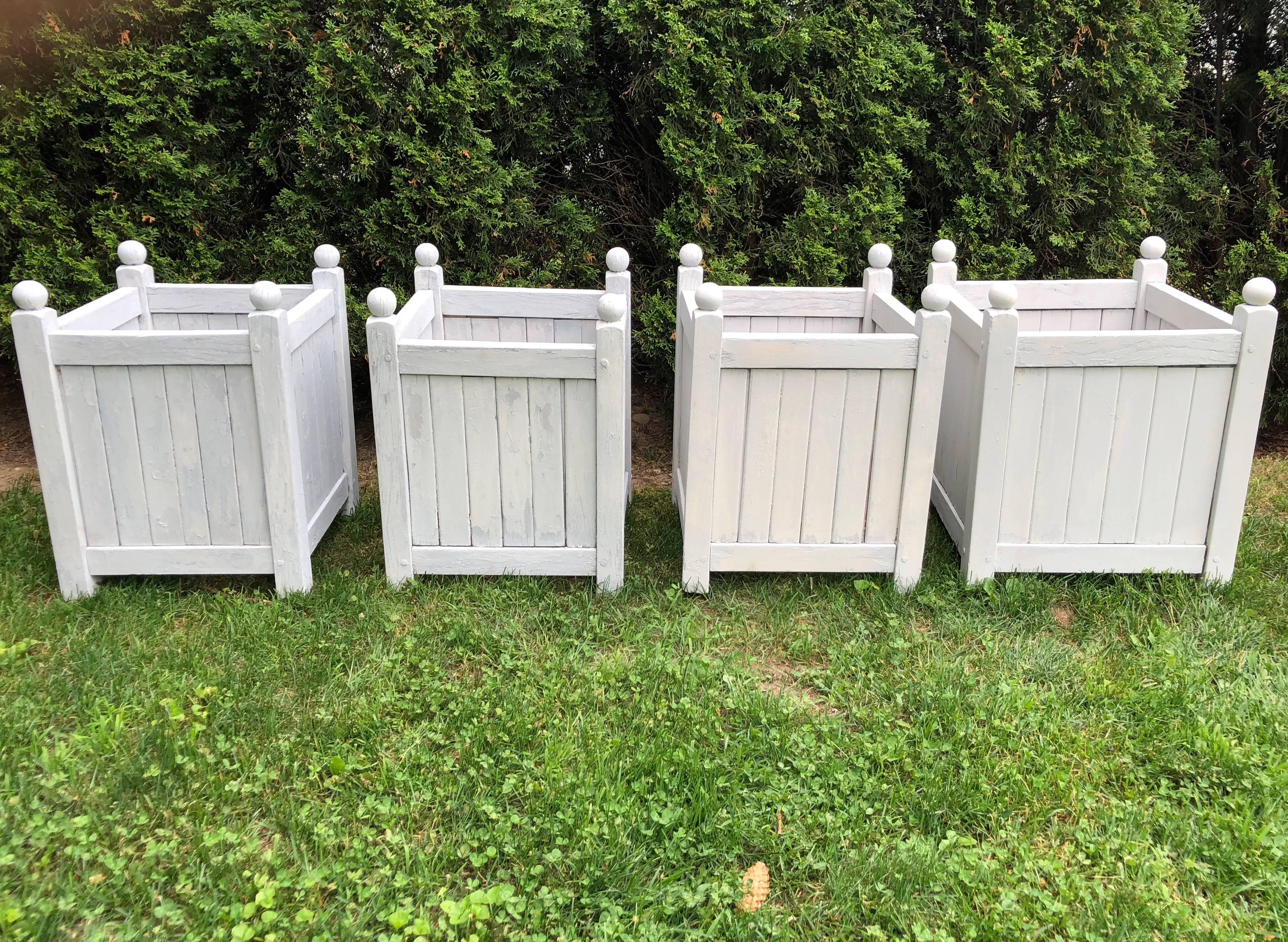 When we bought these in the rain, they had peeling paint and missing slats to the bottom and it was impossible to tell that they are actually two different sizes. However, they have since been restored and washed in a very pale grey paint and we