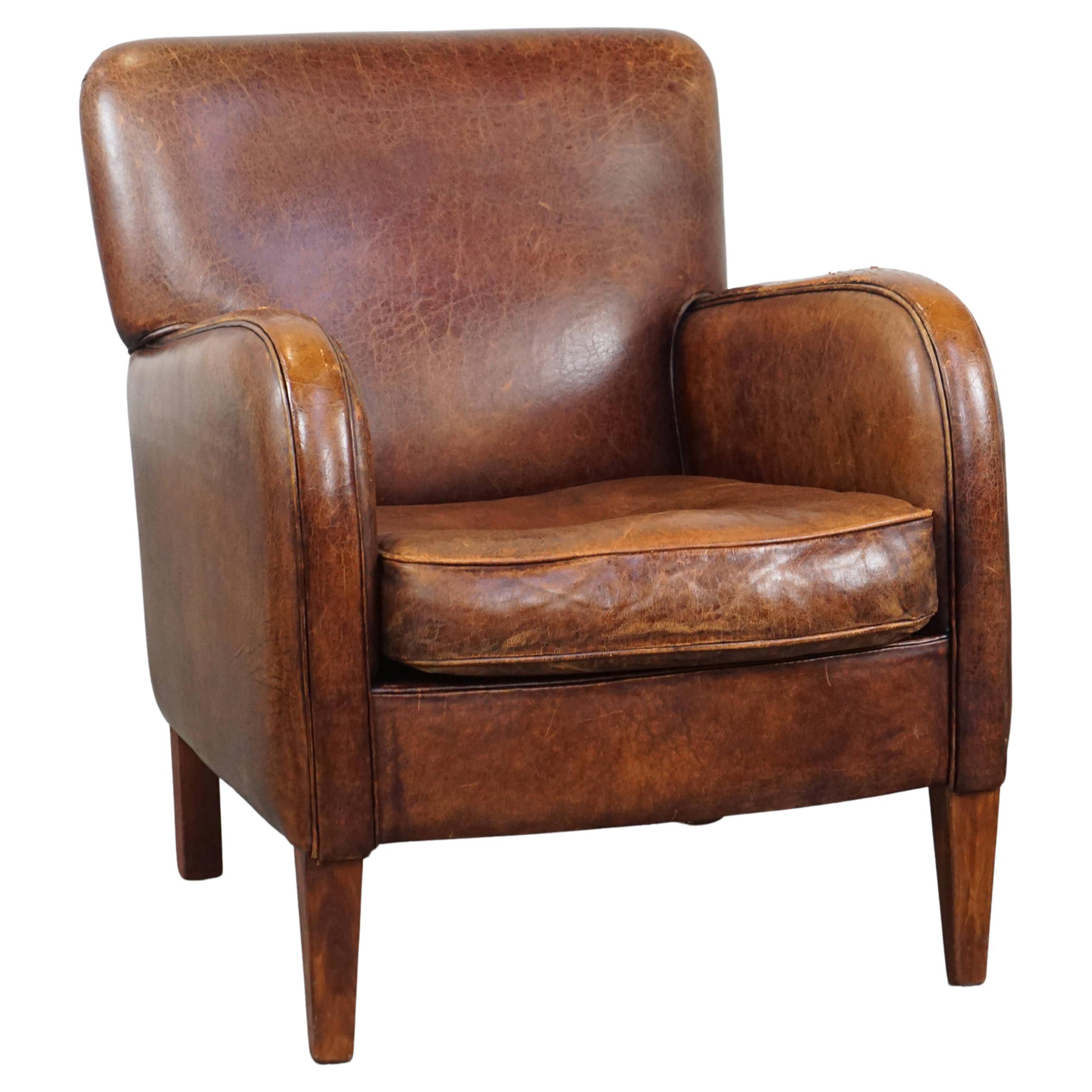 Neat, comfortable sheepskin armchair with lots of character and beautiful colors