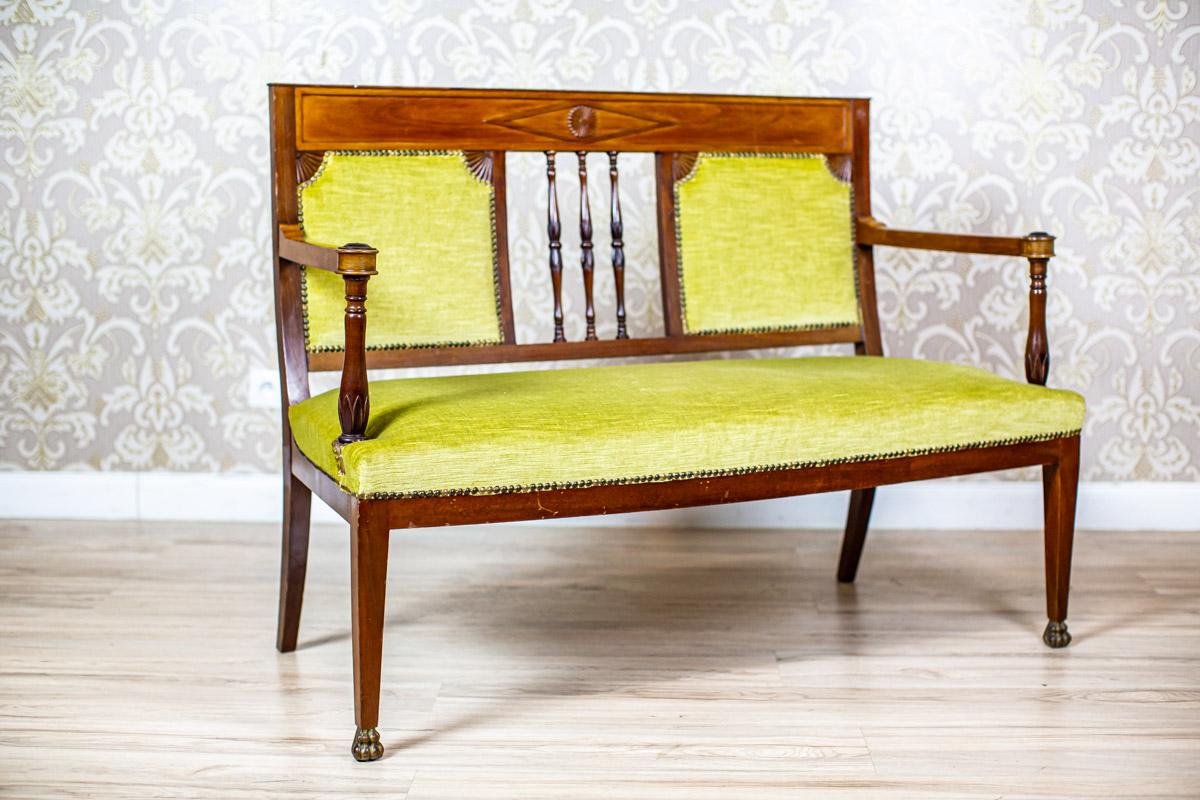 Neat Sofa from the Early 20th Century Upholstered with Green Velour

We present you a wooden sofa from the early 20th century with an upholstered seat and backrest.
This piece of furniture is in the form of a bench with the rails placed on round