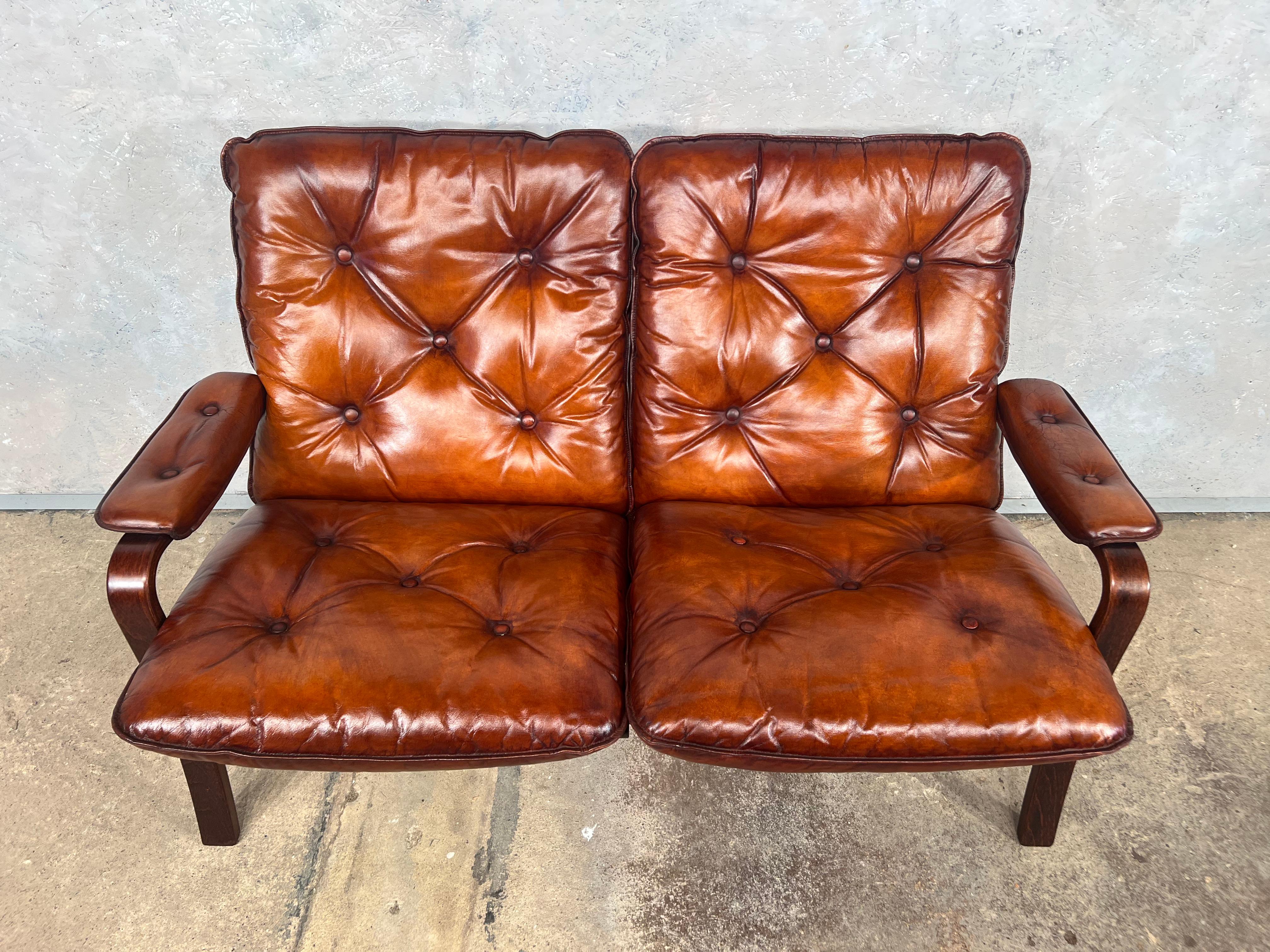 A Stylish 1970s Sofa, great design with beautiful lines, sits wonderfully with neat proportions.

Stunning hand dyed cognac colour, great patina and finish. Great quality sofa, with a Bentwood Beech Frame.

Viewings welcome at our showroom in Lewes,