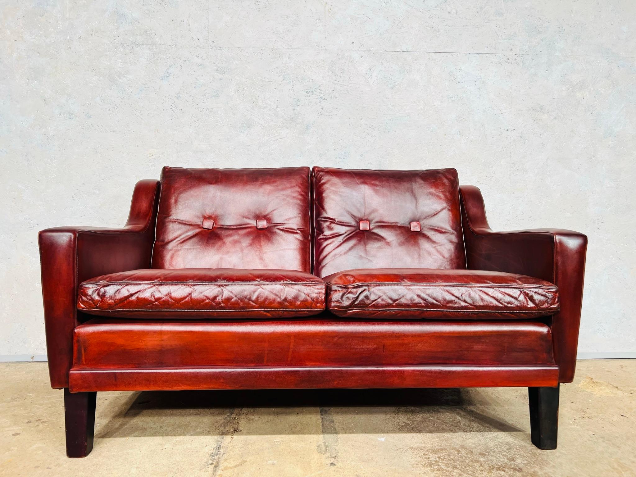 A very neat Danish 1970s sofa with buttoned cushions and great lines.

Stunning hand-dyed patinated deep chestnut brown color with great patina and finish.

