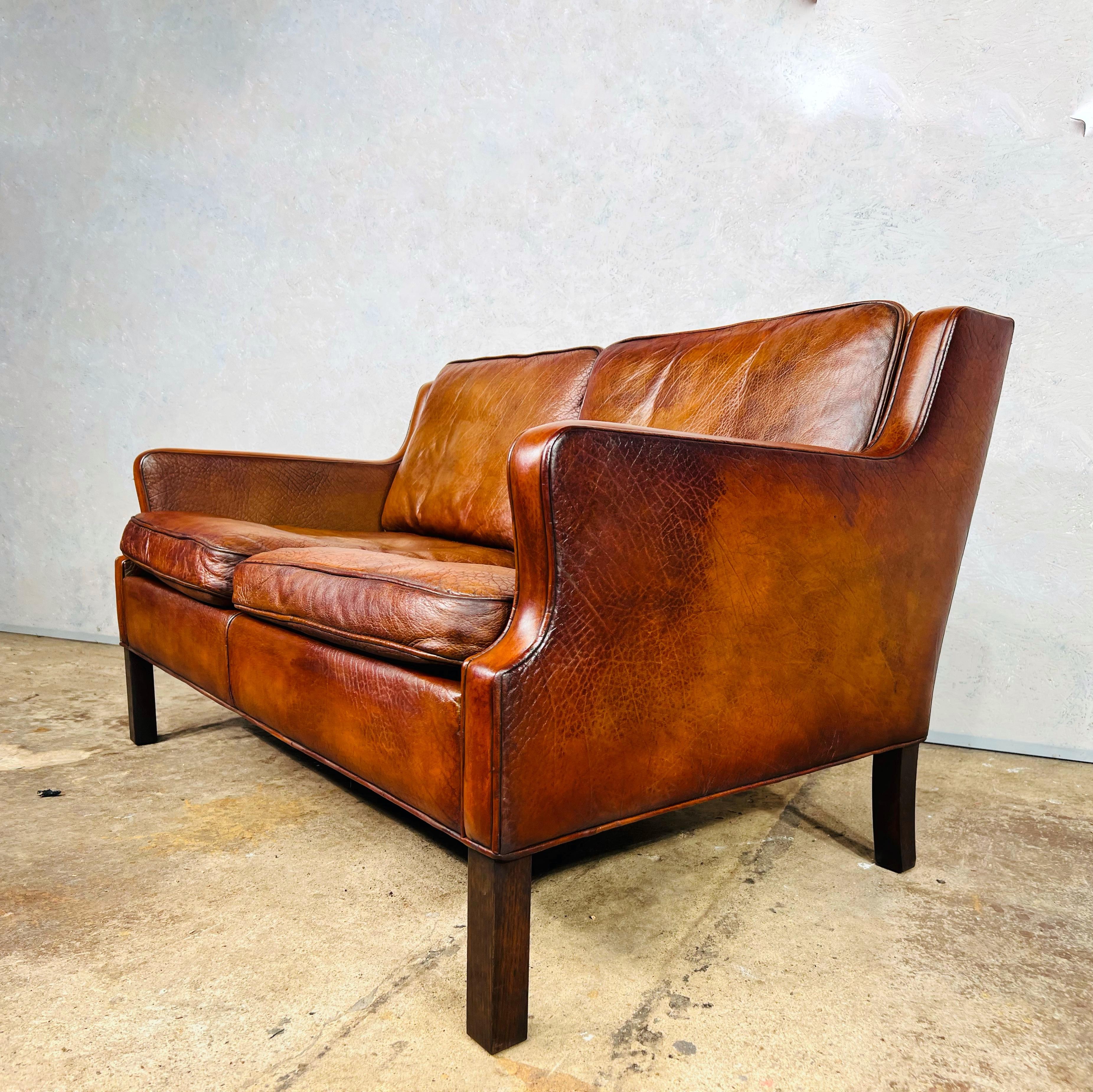 A Stylish Danish 1970s sofa great design with beautiful lines, sits wonderfully.

Stunning hand dyed patinated tan color, great patina and finish.


