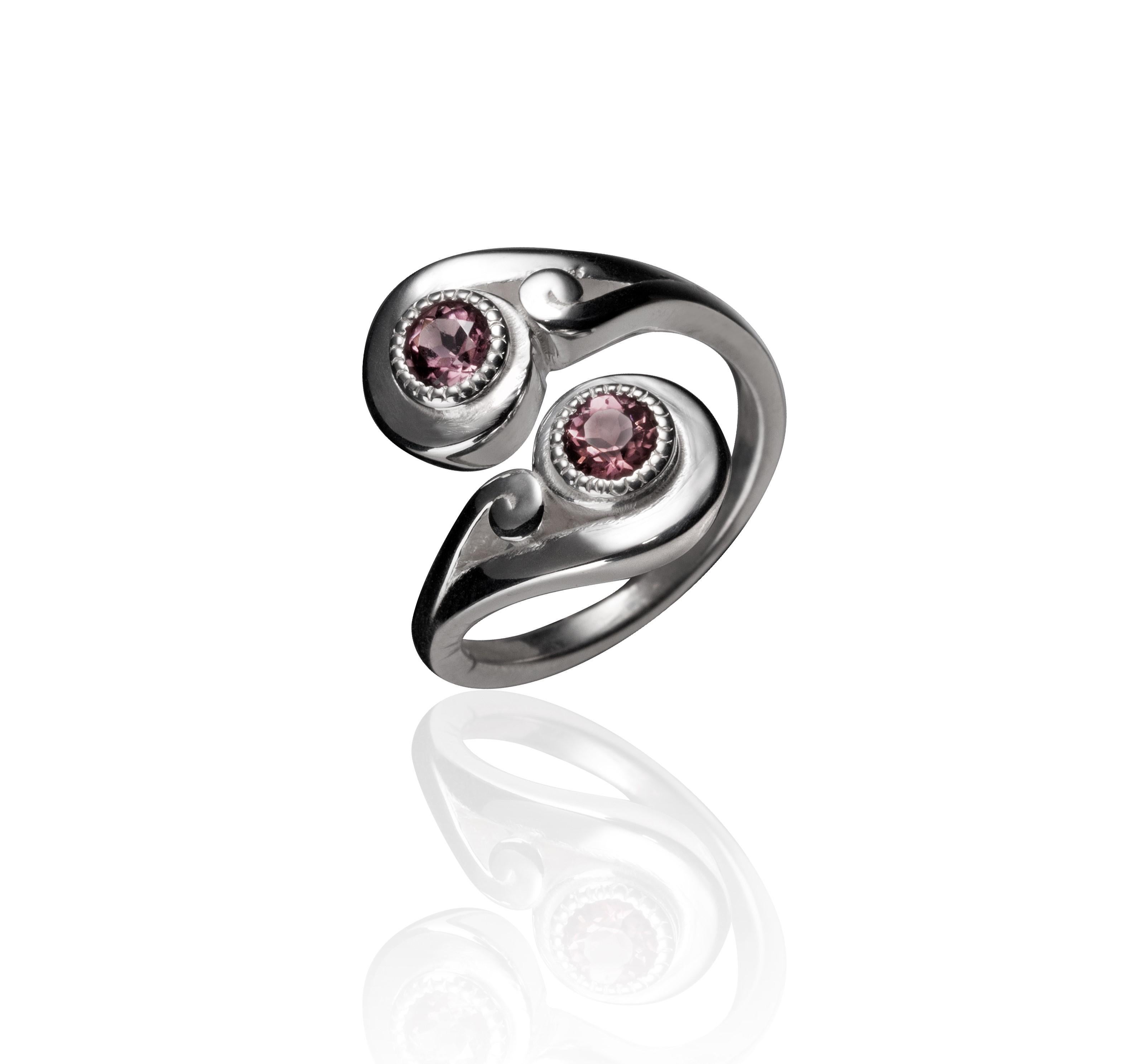 Two simple, sterling silver double spirals from the Nebula collection cross over one another to form a fun and daily wear elegant ring that is somewhat size adjustable and fun to stack 2 together! The design celebrates the spiral nebulae of the