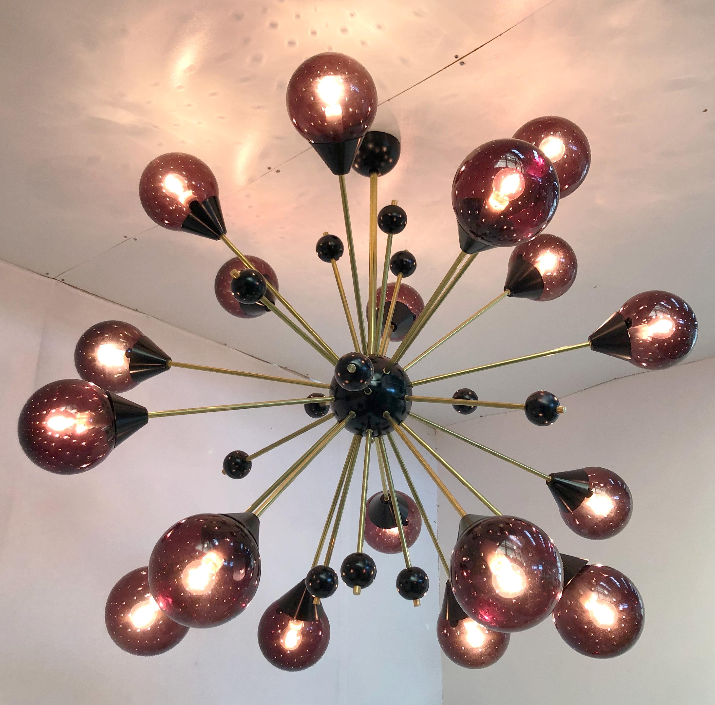 Italian midcentury style Sputnik chandelier with 18 amethyst Murano glass globes with carefully blown bubbles within the glass using Bollicine technique, mounted on unlacquered natural brass stems, with small black decorative globes, black center