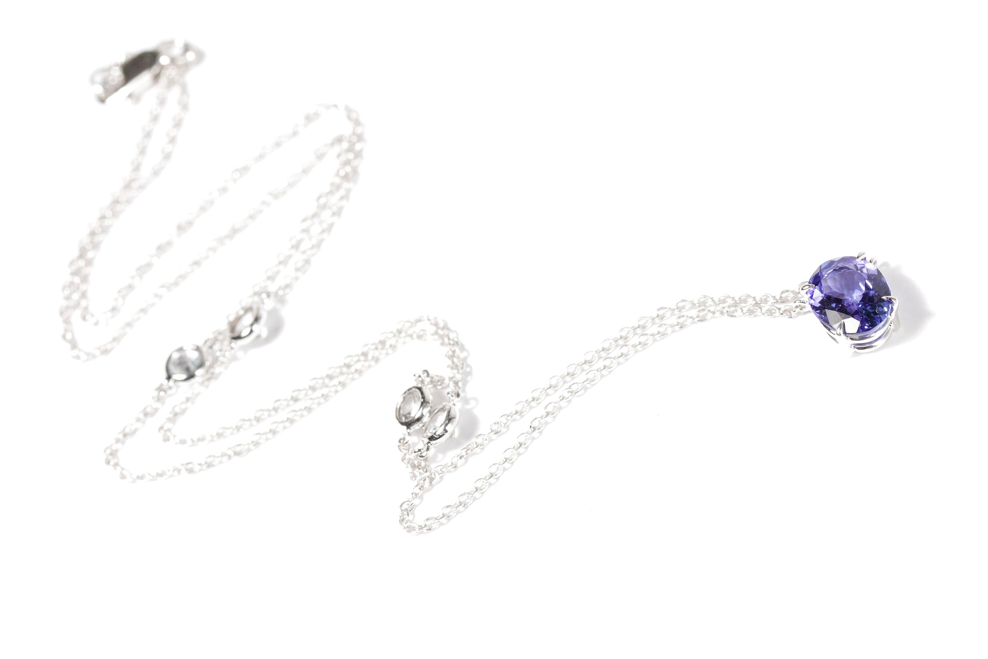 Designed exclusively by Ara Vartanian, this 18 Karat White Gold Necklace features an oval faceted 71.68 Carat Tanzanite with four round faceted colourless Sapphires totalling 0.84 Carats.