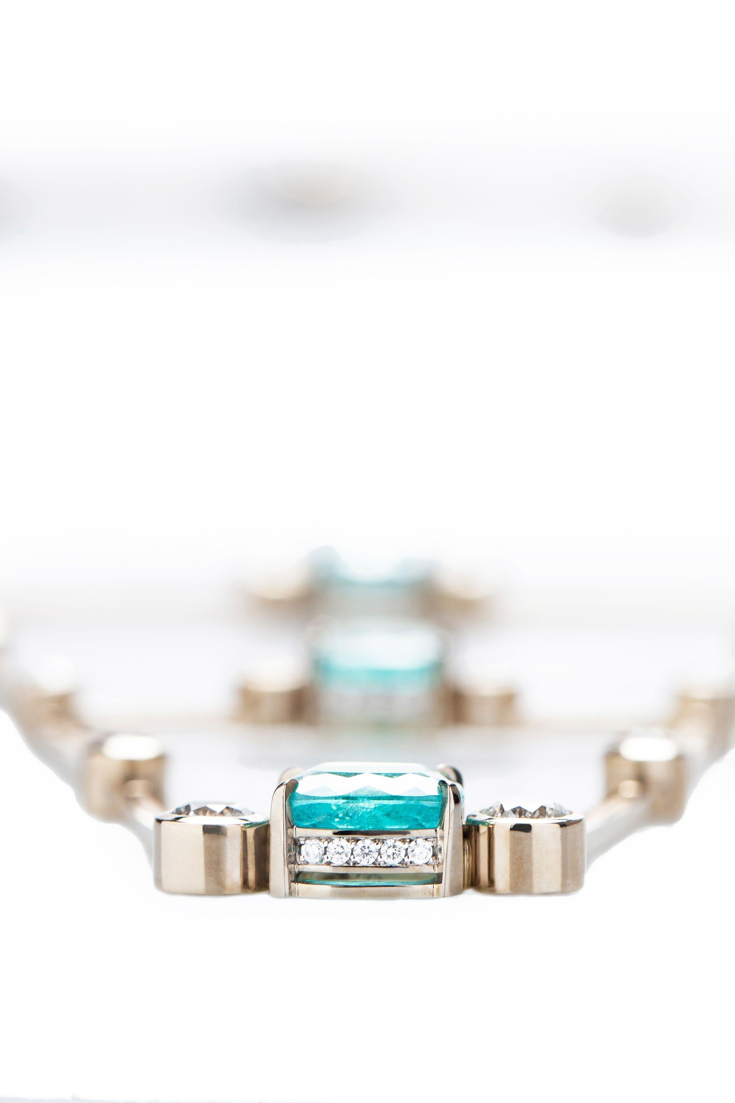 This Brazilian designed statement necklace has been exclusively designed by Ara Vartanian and was hand-crafted in his Sao Paulo Atelier. It features an 18K White Gold necklace enhanced with a Paraiba Tourmaline, weighing 12.89ct (twelve carats and
