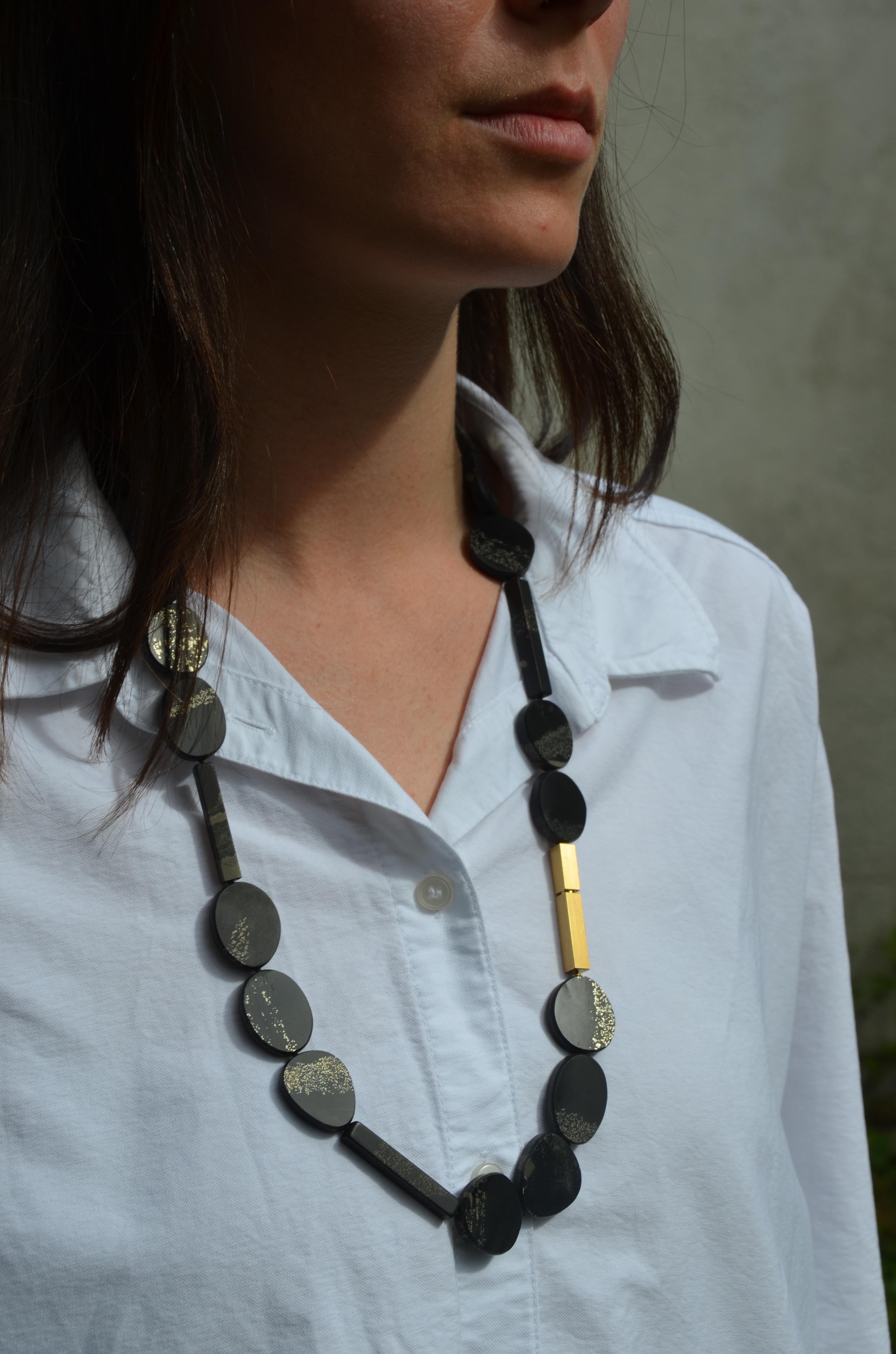 Contemporary 18 Karat Yellow Gold Slate Pyrite Necklace.

A one-of-a-kind necklace with a slate pyrite with simmering gold sparkles and a 18 karat yellow gold clasp.

Fine jewelry, high quality, delicate materials, unique design, a melange of art