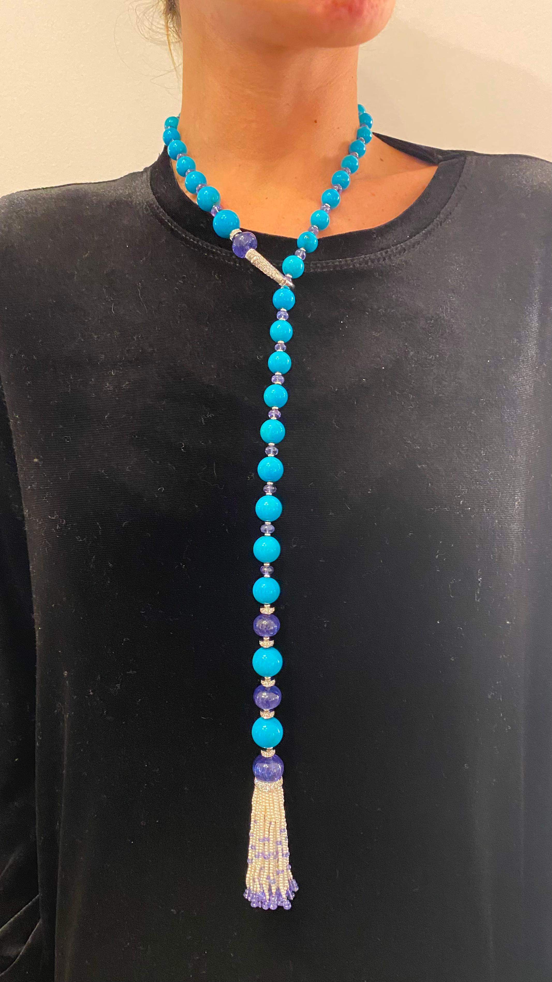 Introducing the EGIZIA Turquoise and Tanzanite Necklace, an exquisite piece crafted in 18K white gold, designed to evoke the splendor of ancient seas and the allure of precious gemstones. The necklace features large natural Persian turquoise