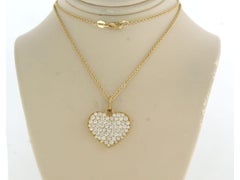 Necklace and hartshaped pendant with brilliant cut diamonds 1.50ct 18k gold