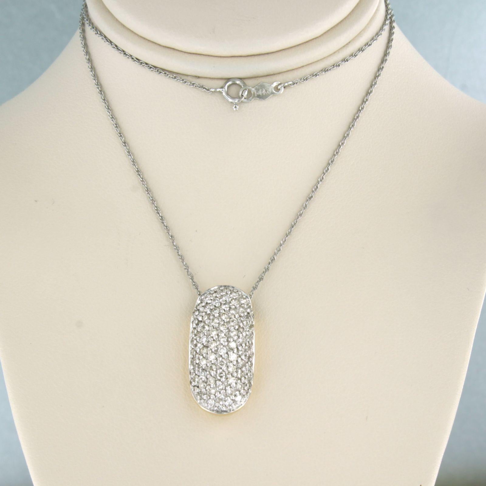 14k white gold necklace with a bicolor pendant set with brilliant cut diamonds up to. 1.00ct - F/G - VS/SI - 40 cm long

detailed description:

necklace is 40 cm long and 0.8 mm wide

size of the pendant is approximately 2.2 cm by 1.1 cm wide

total