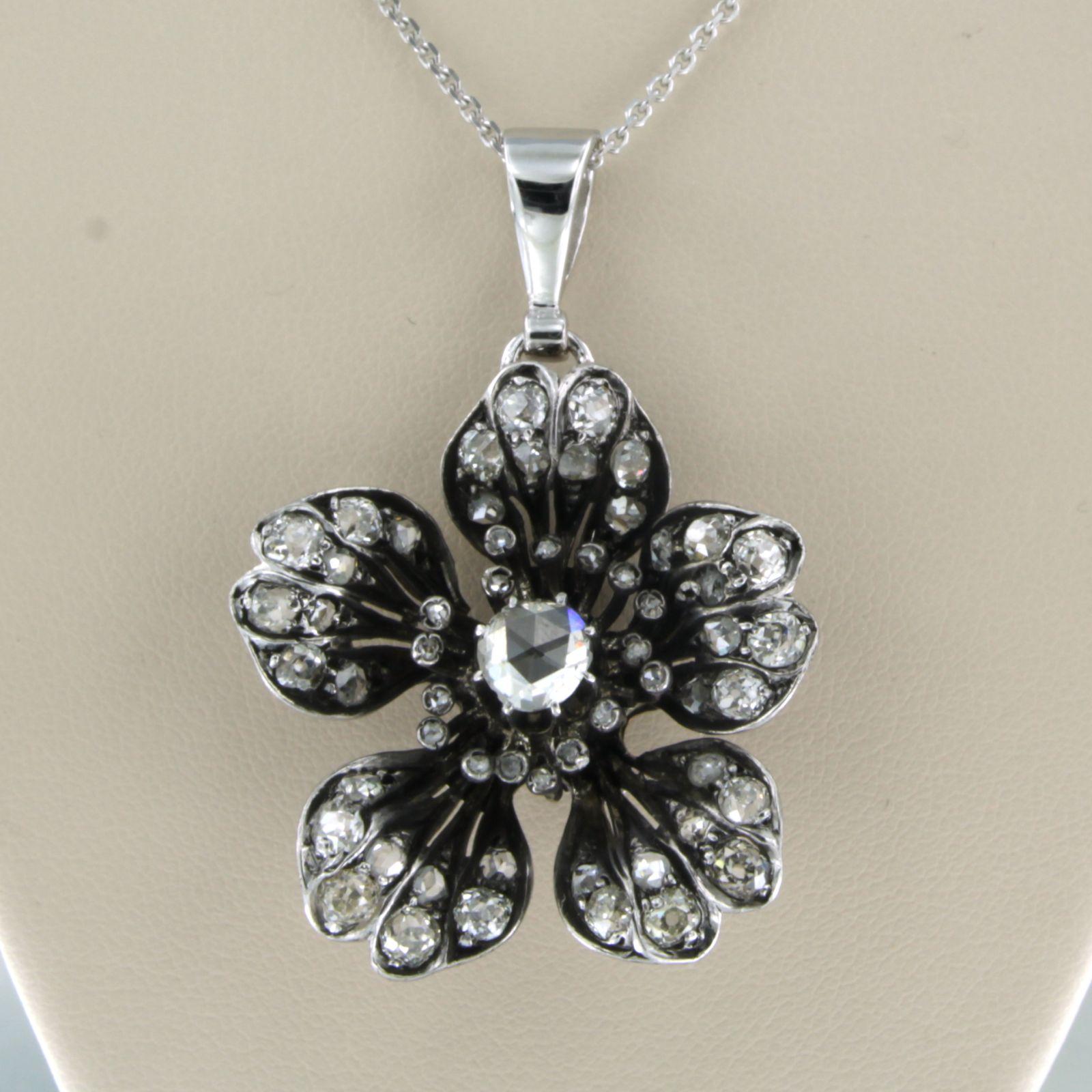 14k white gold necklace with a gold and silver pendant set with old mine cut and rose diamonds. 3.00ct - 45cm long

detailed description:

the necklace is 45 cm long and 1.0 mm wide.

The pendant is 4.6 cm high and 3.2 cm wide.

weight: 14.8