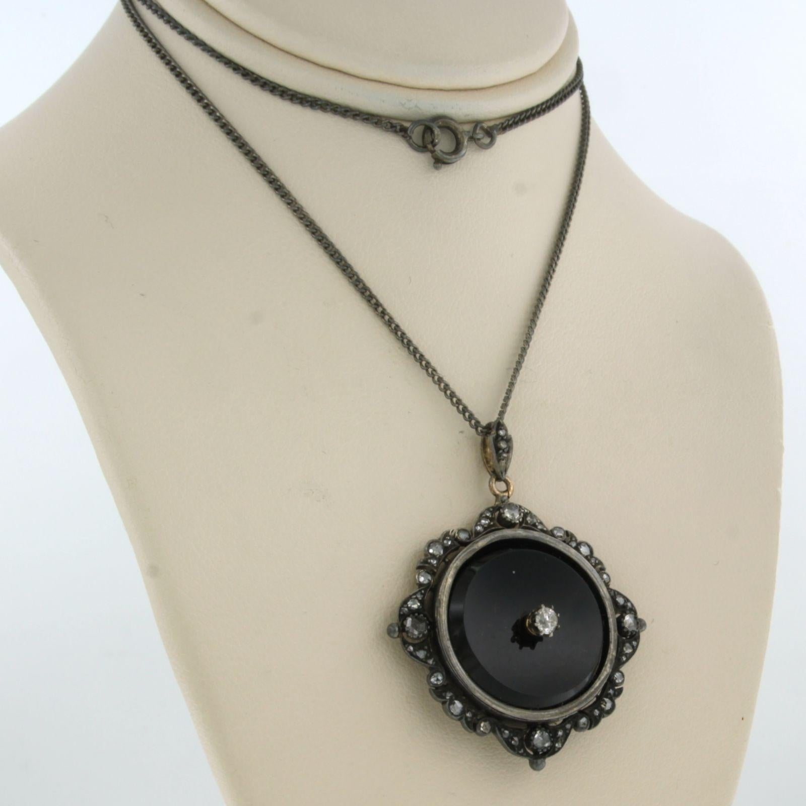 Silver necklace and pendant set with onyx, old mine cut and rose cut diamond. 0.25ct - 40cm long

detailed description:

the length of the necklace is 40 cm long by 1.4 mm wide

size of the pendant is 3.8 cm by 3.1 cm wide

weight 9.4