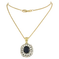 Necklace and pendant set with Sapphire and diamonds 18k gold