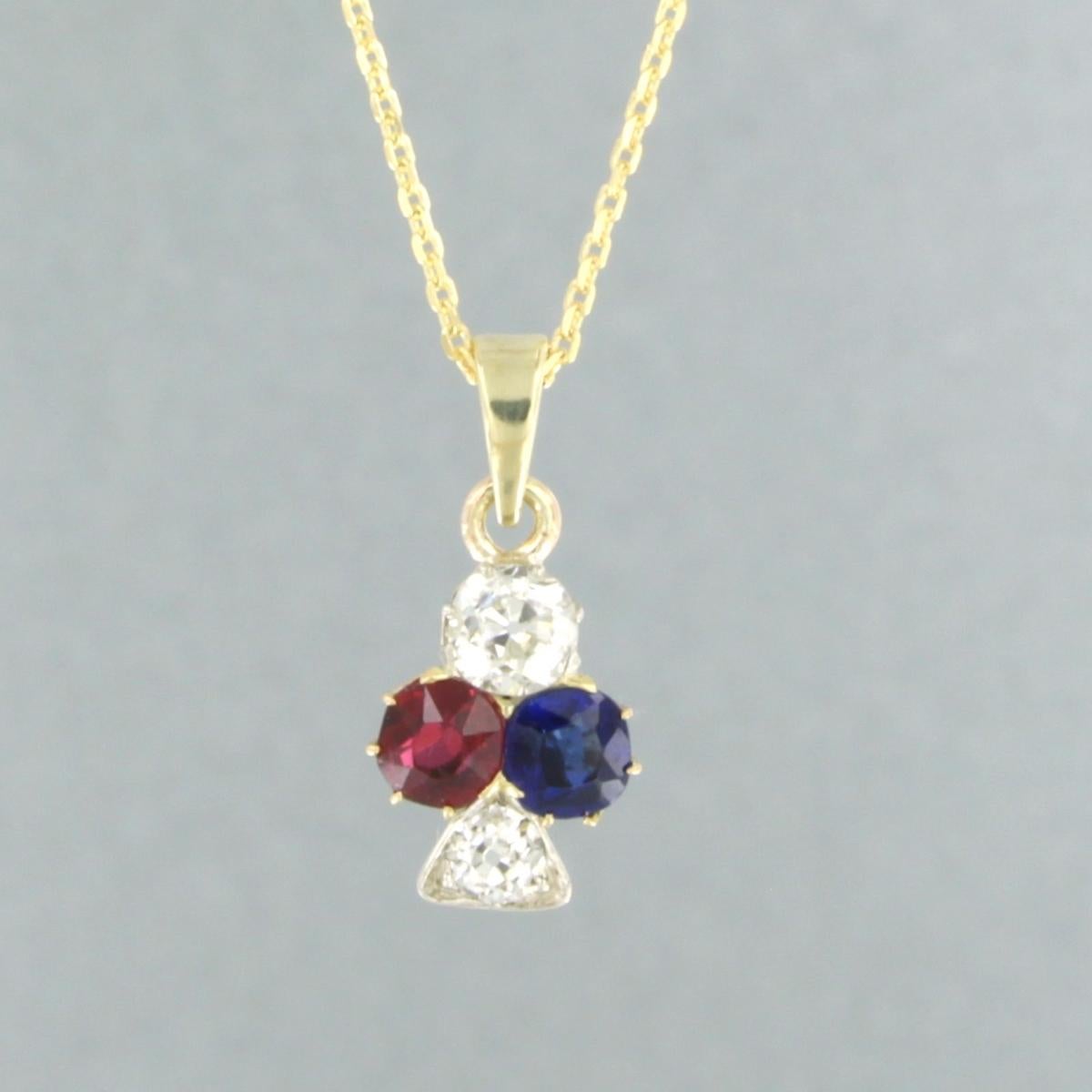 14k yellow gold necklace with a bicolor gold pendant set with ruby, sapphire and old mine cut diamond. 0.50ct - H/I - SI - 45 cm long

detailed description

necklace is 45 cm long and 0.9 mm wide

size of the pendant is approximately 1.8 cm by 9.0