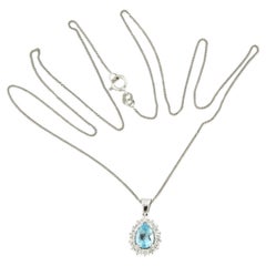 Necklace and pendant set with topaz and diamonds 14k white gold