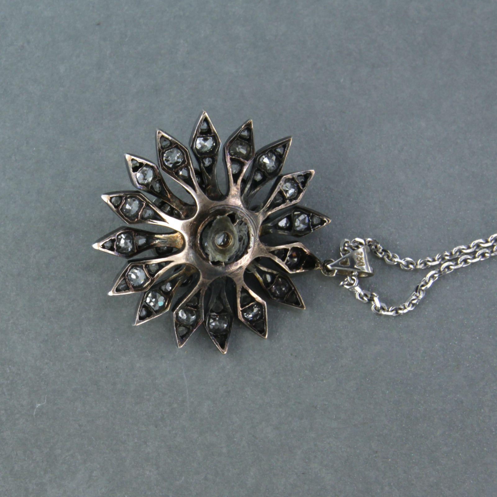 14k white gold necklace with a gold and silver pendant set with old mine cut and rose diamonds up to 1.50ct - F/G - SI - 45 cm long

detailed description:

the length of the necklace is 45 cm long by 0.9 mm wide

the size of the pendant is 3.1 cm