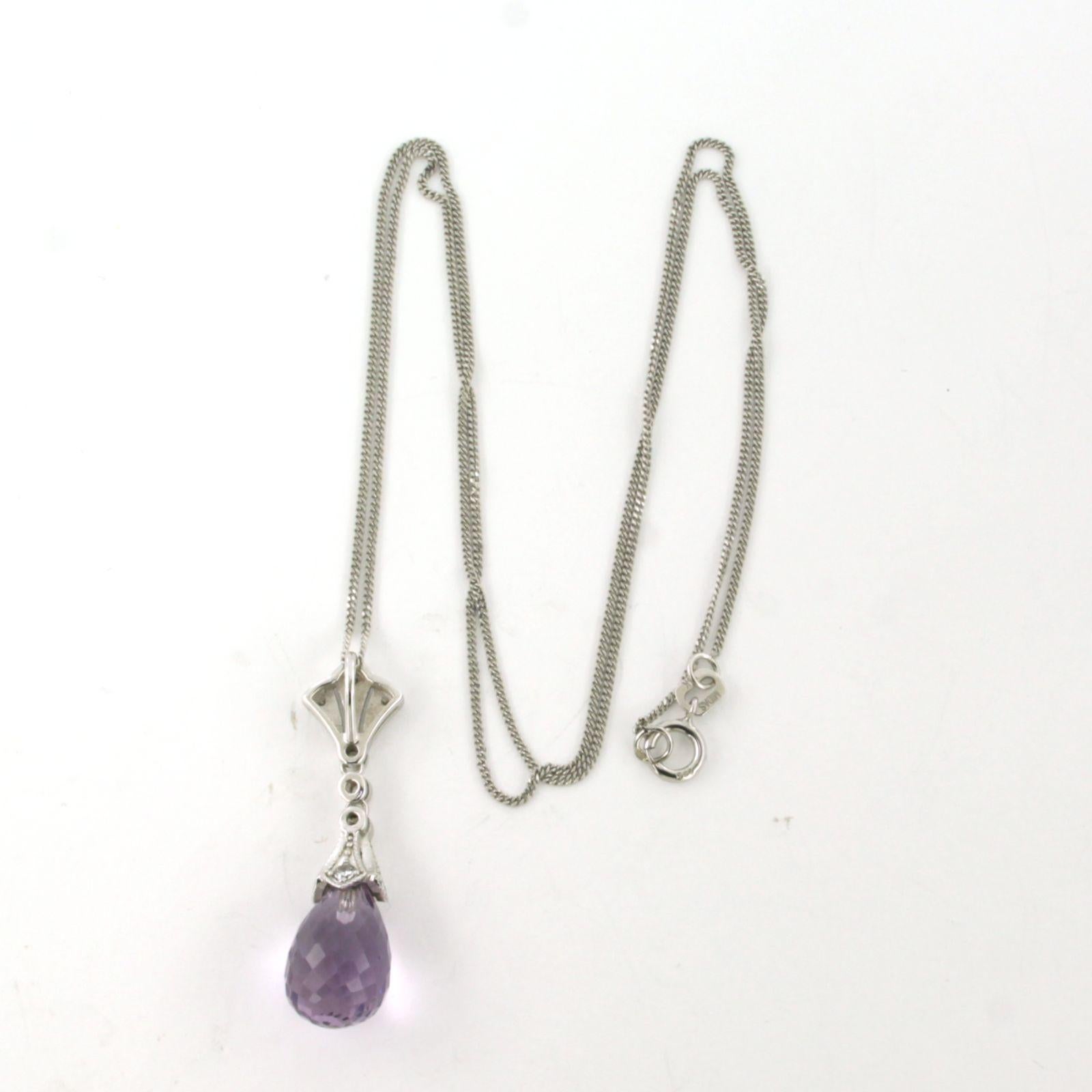 14k white gold necklace and pendant set with amethyst and brilliant cut diamond total approximately 0.20ct - F/G - VS/SI - 45cm long

Detailed description

the length of the necklace is 45 cm long by 0.7 mm wide

the pendant is 3.0 cm high and 8.0