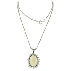 Necklace and pendant with opal and brilliant cut diamonds up to 0.54ct 14k gold