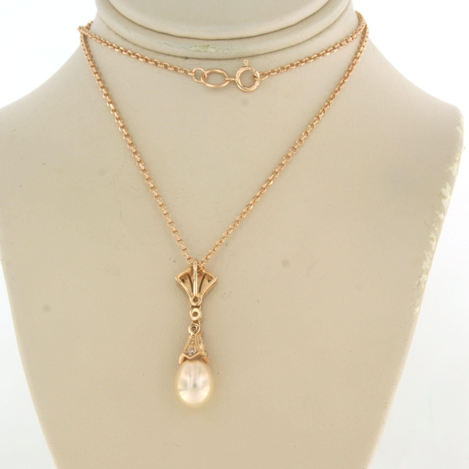 Collier en or rose 14k avec pendentif serti d'une perle et d'un diamant taille unique 0.20ct - F/G - VS/SI - 45 cm de long

description détaillée :

Le collier mesure 45 cm de long et 0,7 mm de large.

la taille du pendentif est d'environ 2,7 cm de