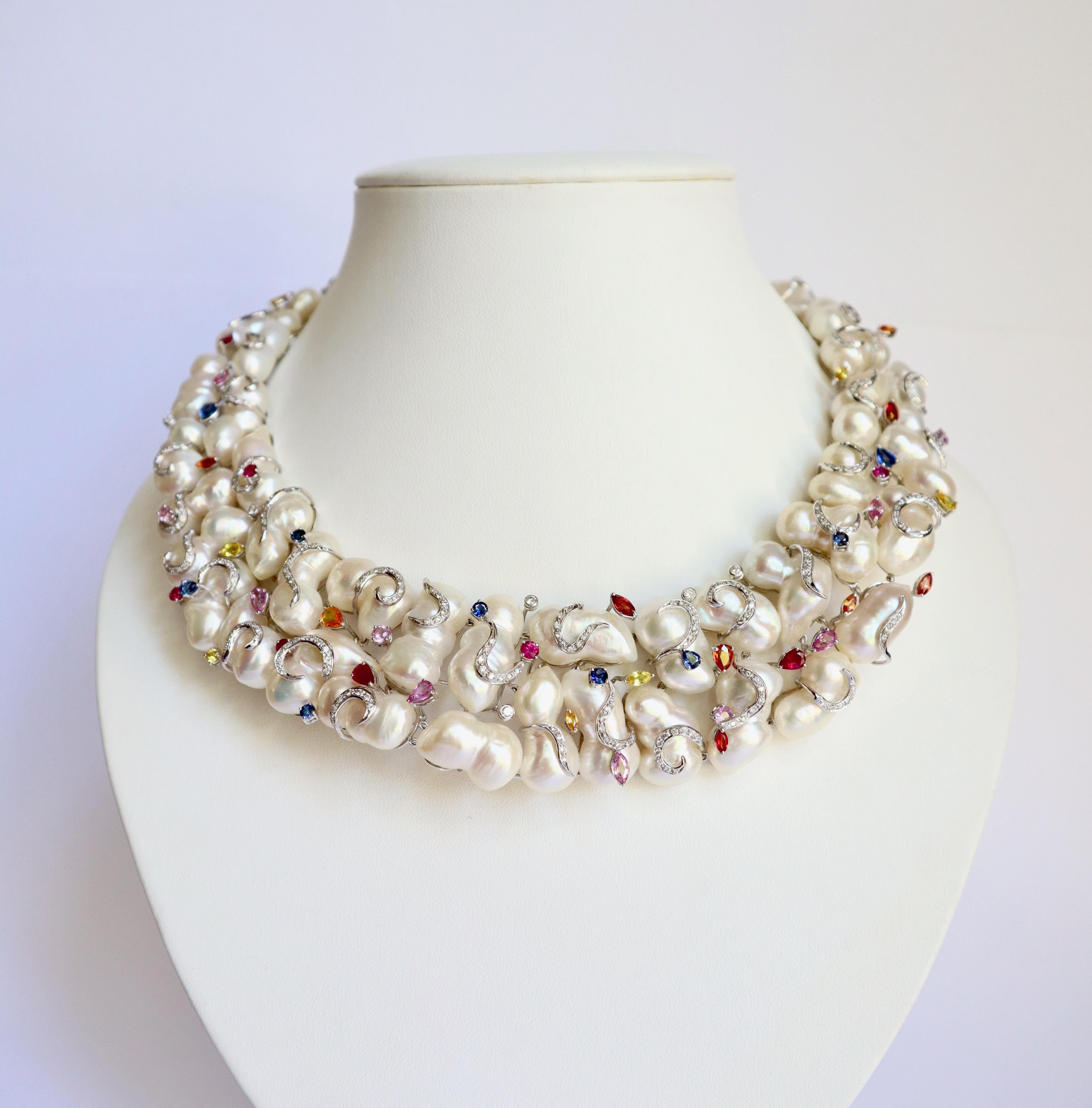 Multicolored sapphire and diamond baroque pearl necklace. 18K white gold setting. It is composed of 45 baroque pearls, 46 multicolored sapphires of various shapes and colors (navettes, pears, rounds) for a total weight of 12.21 carats and 292