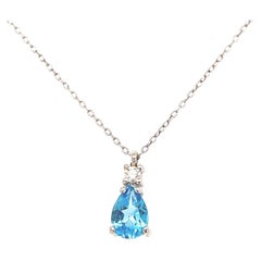 Necklace Blue Topaz Pendant with a Diamond White Gold