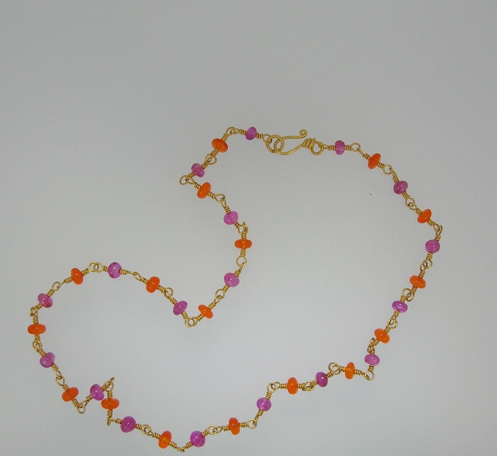 This vibrant necklace pairs vivid Burmese Rubies with glowing Mexican Fire Opals, creating a lively interplay of color. Beautiful worn on its own, it also layers effortlessly with other chains or can serve as a striking support for a pendant.
The