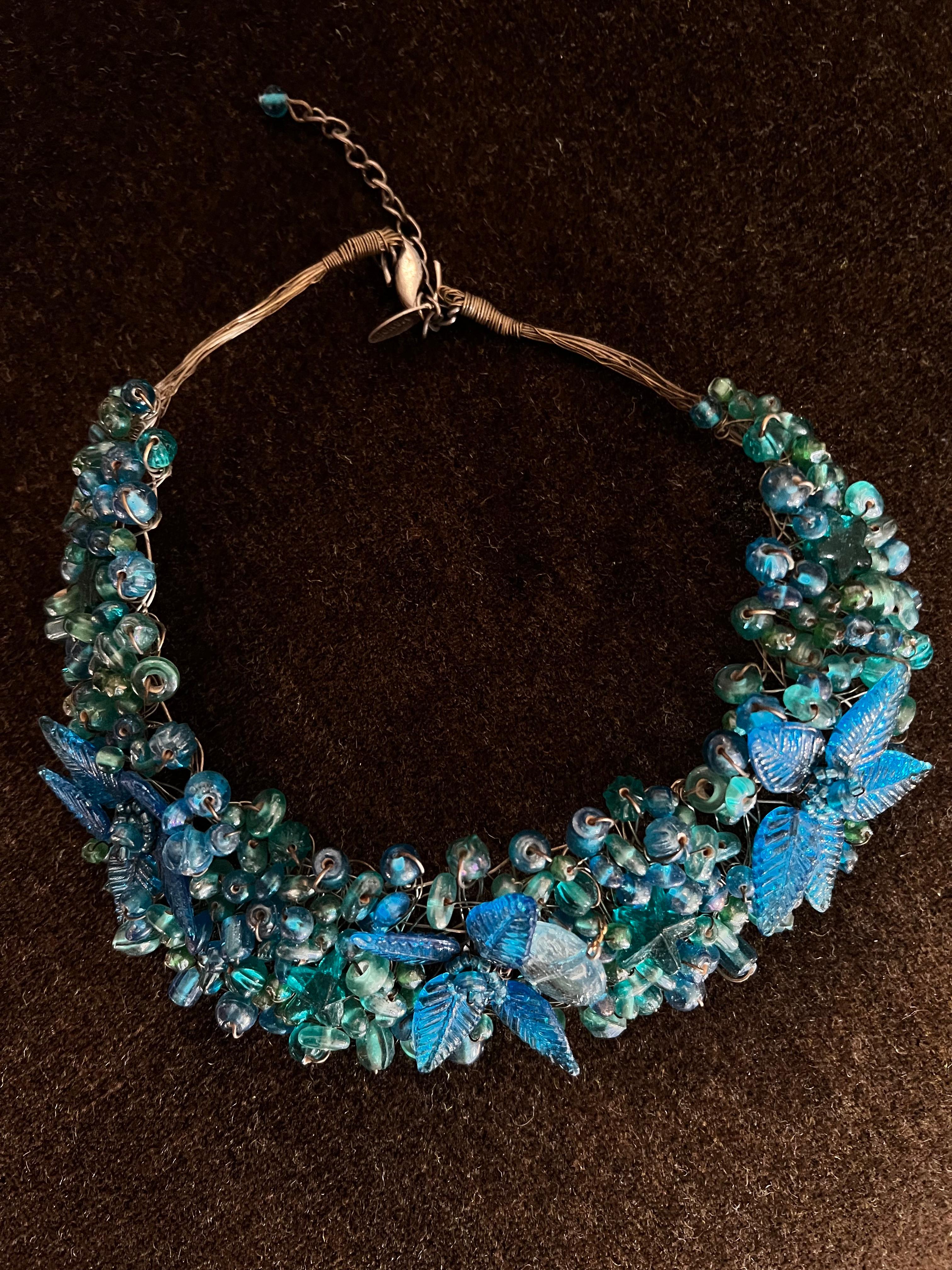 A hand crafted blue glass beaded choker / necklace.   a lovely piece for the right person.  The length without the added 1