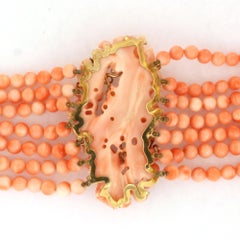 Collier composé de perles de corail, d'une perle et de diamants taille brillant d'un poids total maximal de 0,20 ct, en or 14 carats