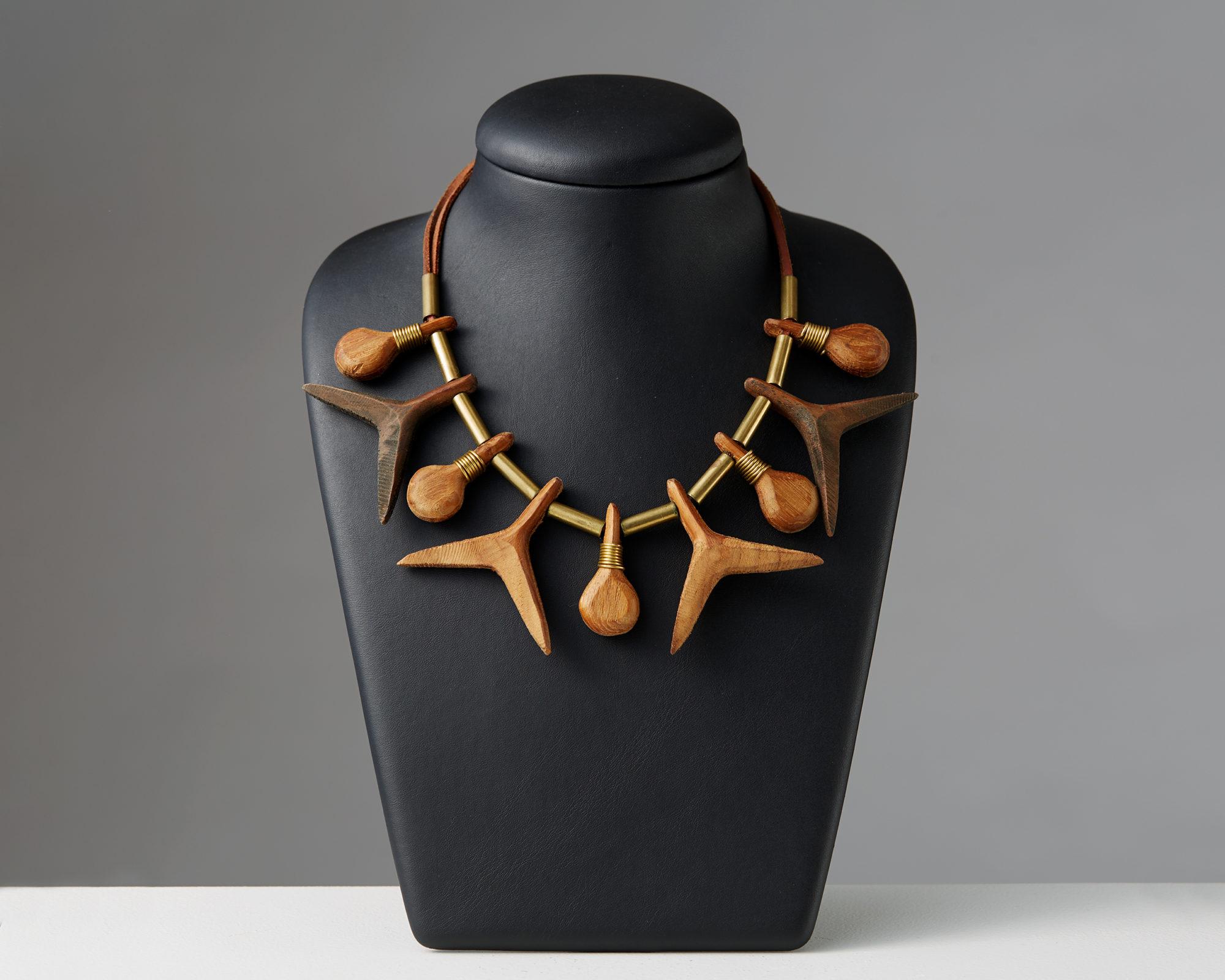 Necklace designed by Torun Bülow-Hübe, Sweden, 1948. Leather, brass and wood.
 