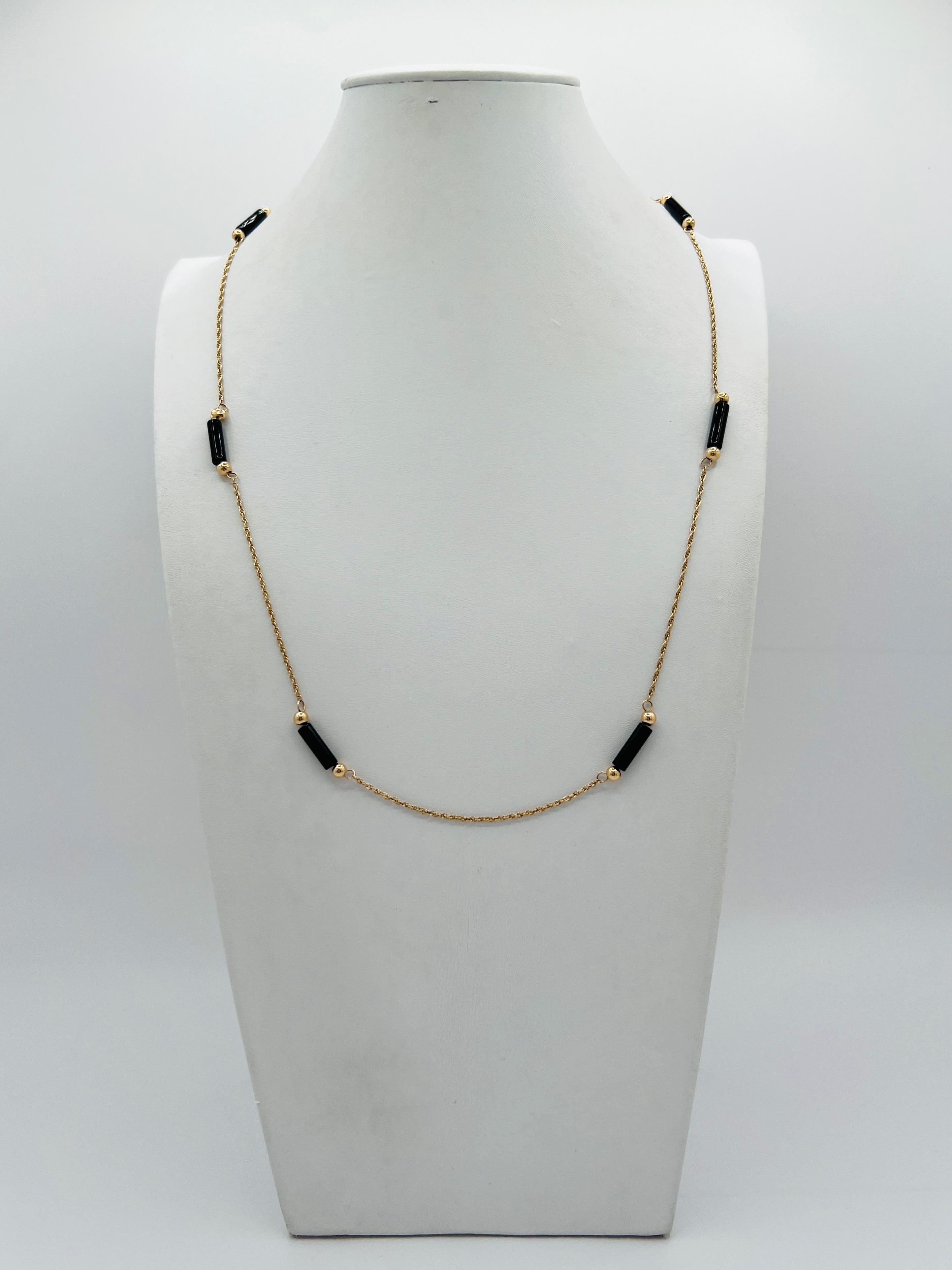 Bellissima collana di perline in oro giallo 14k.  La lunghezza è di 47