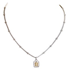 Necklace in 18 Karat Gold, Platinum and Diamonds and 1.5 Carat Yellow Diamond