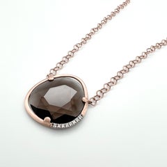 Necklace in 18kt gold chain and with a faceted smoky quartz & natural diamonds