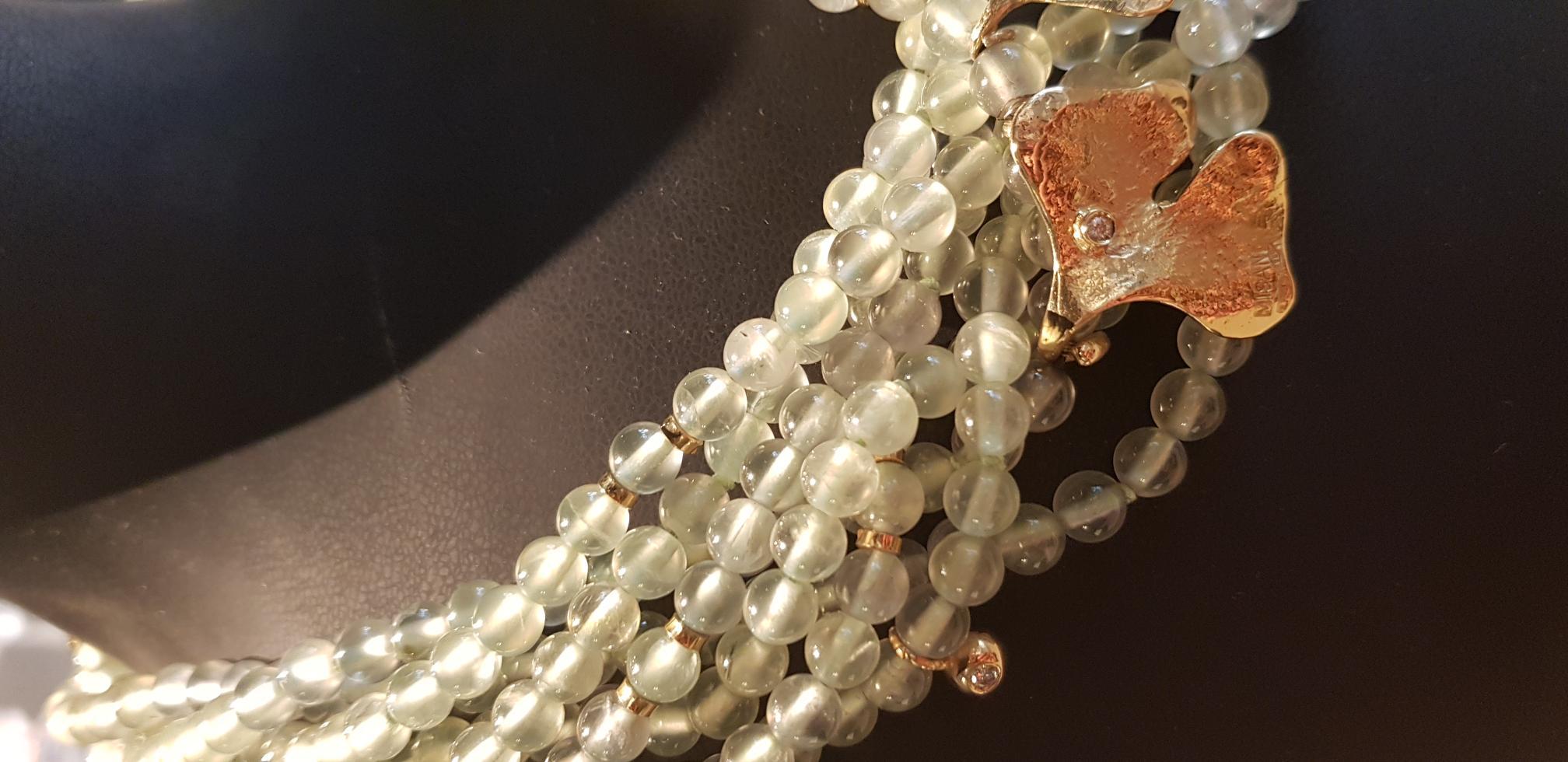 Prasiolite (also known as green quartz or vermarine) is used in this amazing necklace by our italian artisans, with gold 18k Ginko leaves. On the leaves there are some small diamonds and the closing is in 18k yellow gold. 
