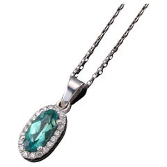 Necklace in white gold with Paraiba tourmaline and diamonds.