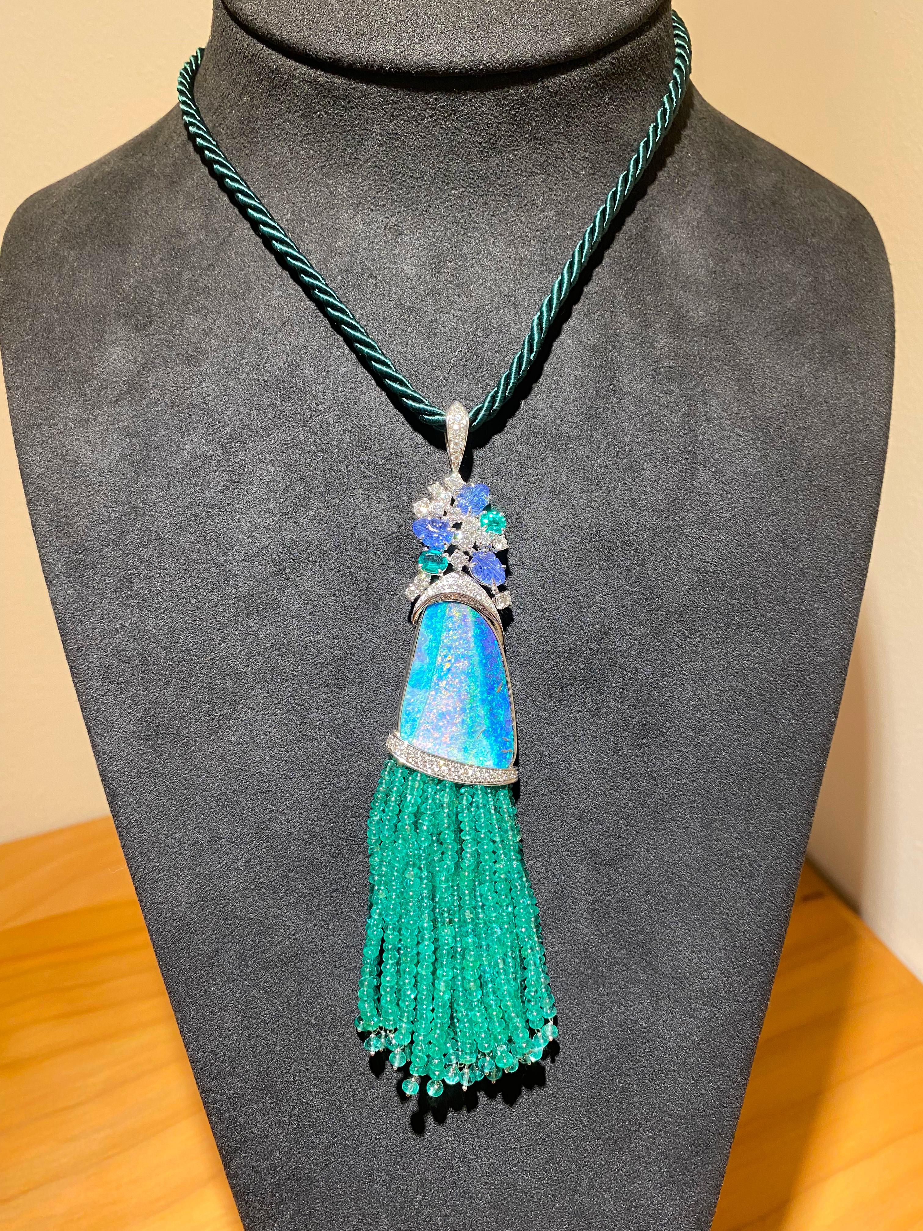 Introducing a truly mesmerizing Pendant Necklace that effortlessly captures the essence of the oceanic beauty and lush greenery. This exquisite piece, a creation of the master Italian jeweler Fulvio Maria Scavia, showcases a stunning Australian blue