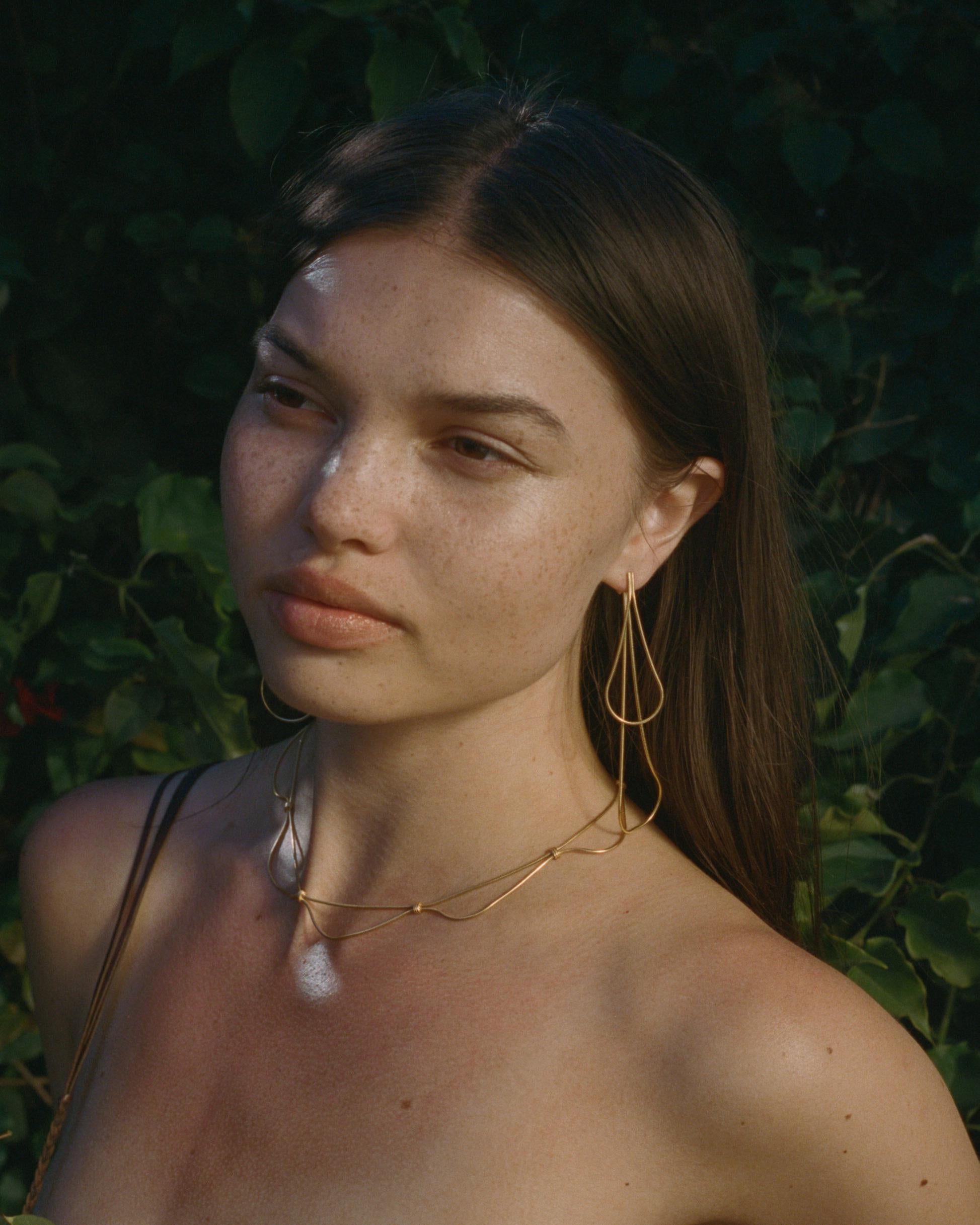  Aura necklace

The aura necklace is a graceful piece inspired by nature's delicate shapes. This piece is made out of gold plated snake chain and will bring elegance to any outfit.

Hand-crafted by local skilled Greek craftsmen.

The design is from