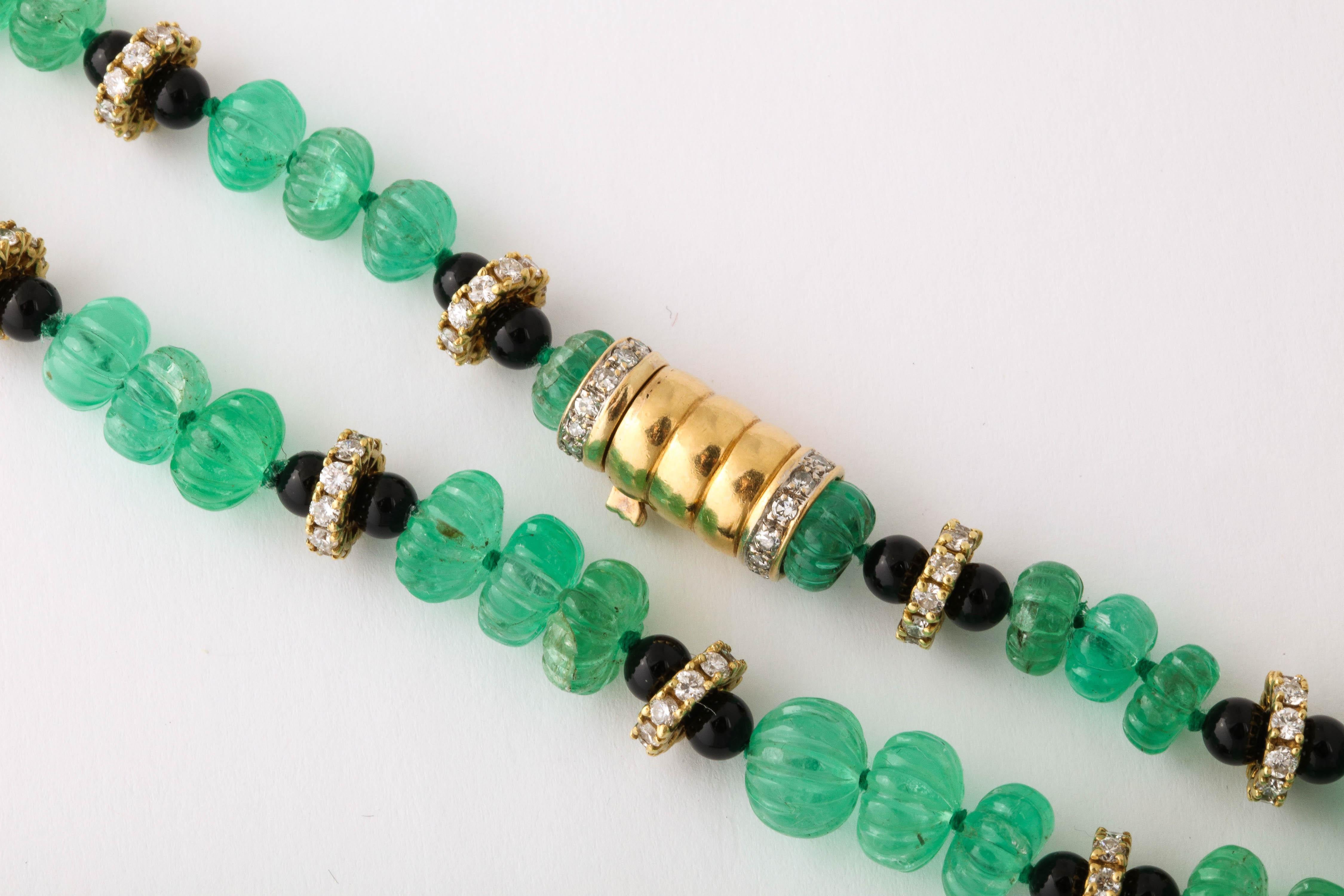 Art Deco Necklace of Graduated Melon Shaped Emerald Beads with Onyx and Diamond Spacers
