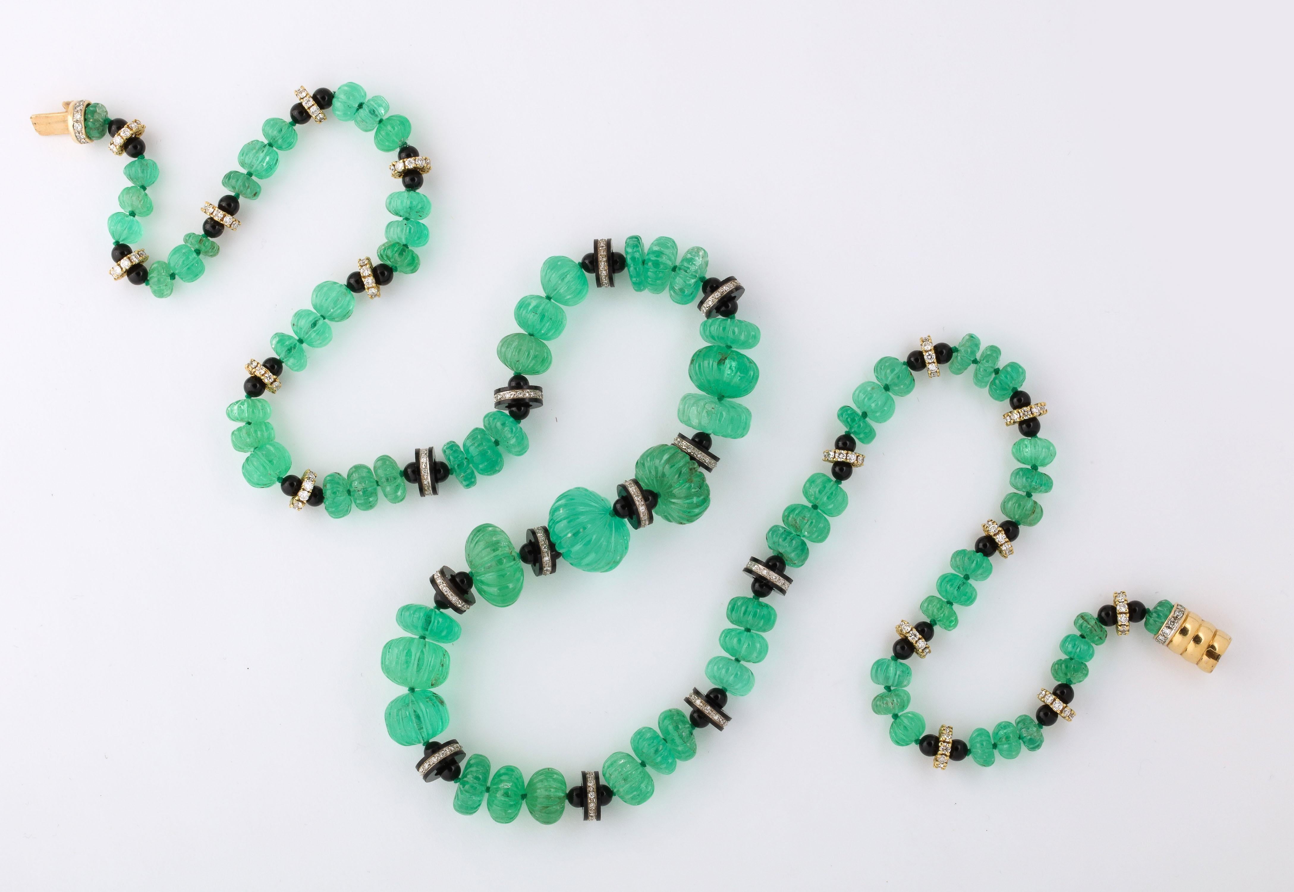 Women's Necklace of Graduated Melon Shaped Emerald Beads with Onyx and Diamond Spacers