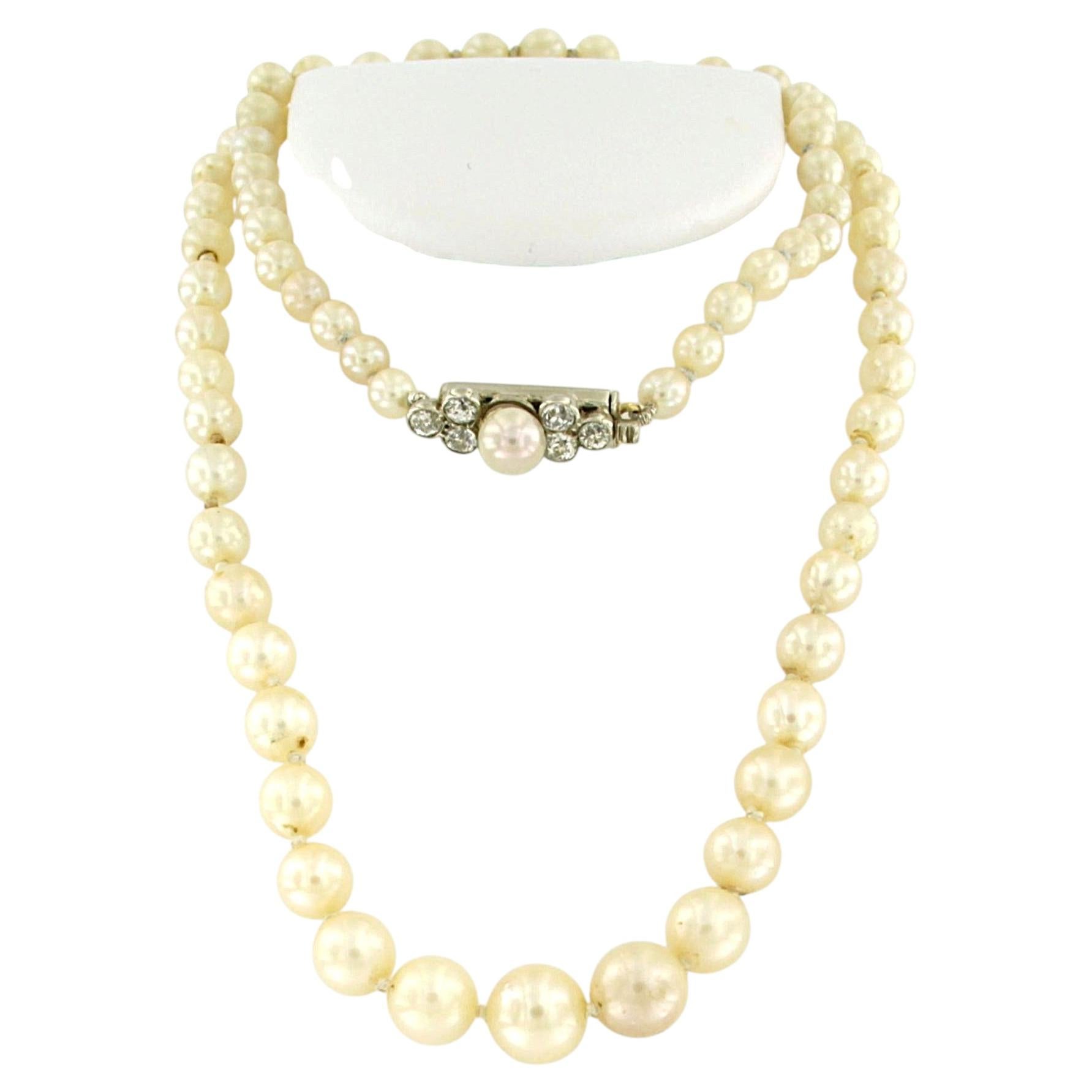 Necklace of pearl bead and lock of 14k gold and silver with diamonds 16.5 grams