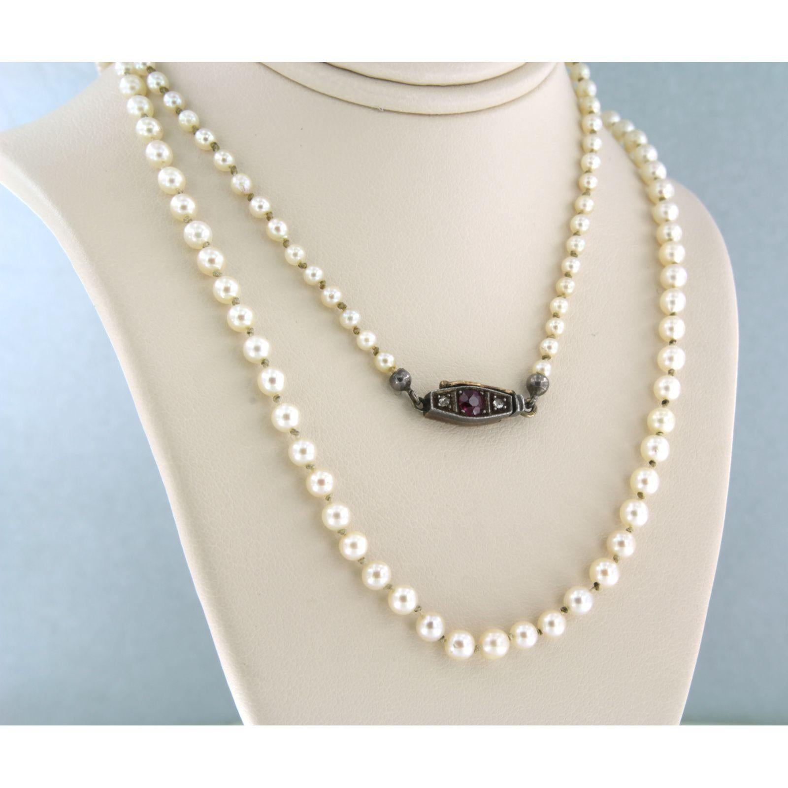 Early Victorian necklace of Pearl with a lock with ruby and diamonds 10k yellow gold and silver For Sale