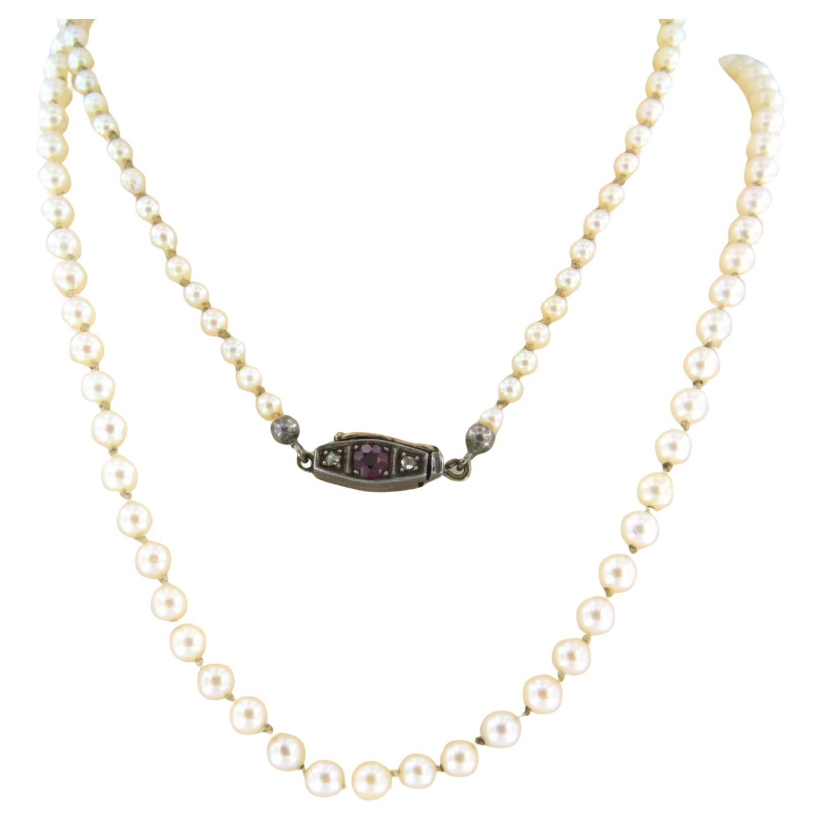 necklace of Pearl with a lock with ruby and diamonds 10k yellow gold and silver For Sale